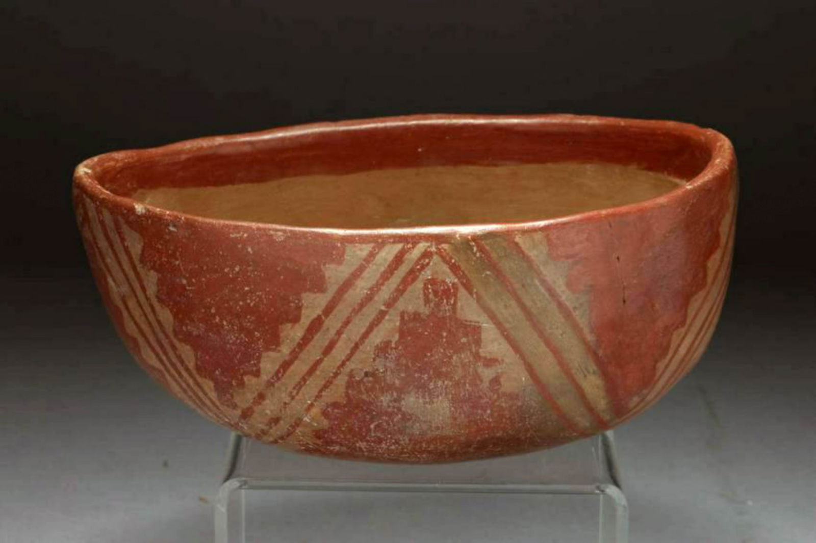 Pre-Columbian Bowl: A pre-classic bowl, ovid shaped, with geometric designs, slightly spouted. 6" L x 2-3/4" H; 12 oz. Provenance: Ex. D. Harner, acquired 50's - 60's