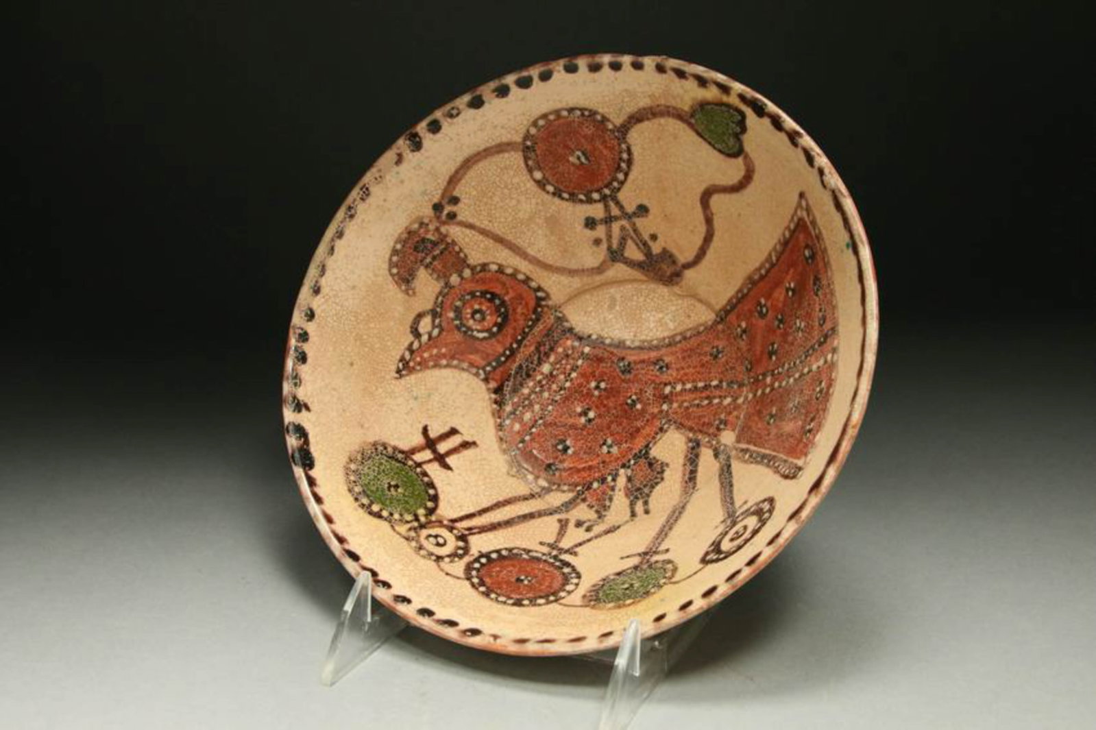 Persian Ceramic Bowl: An antique ceramic bowl with bird design interior. Crazing in glaze. Collector's catalog numbers on reverse. 8" Dia x 3-1/2" H.