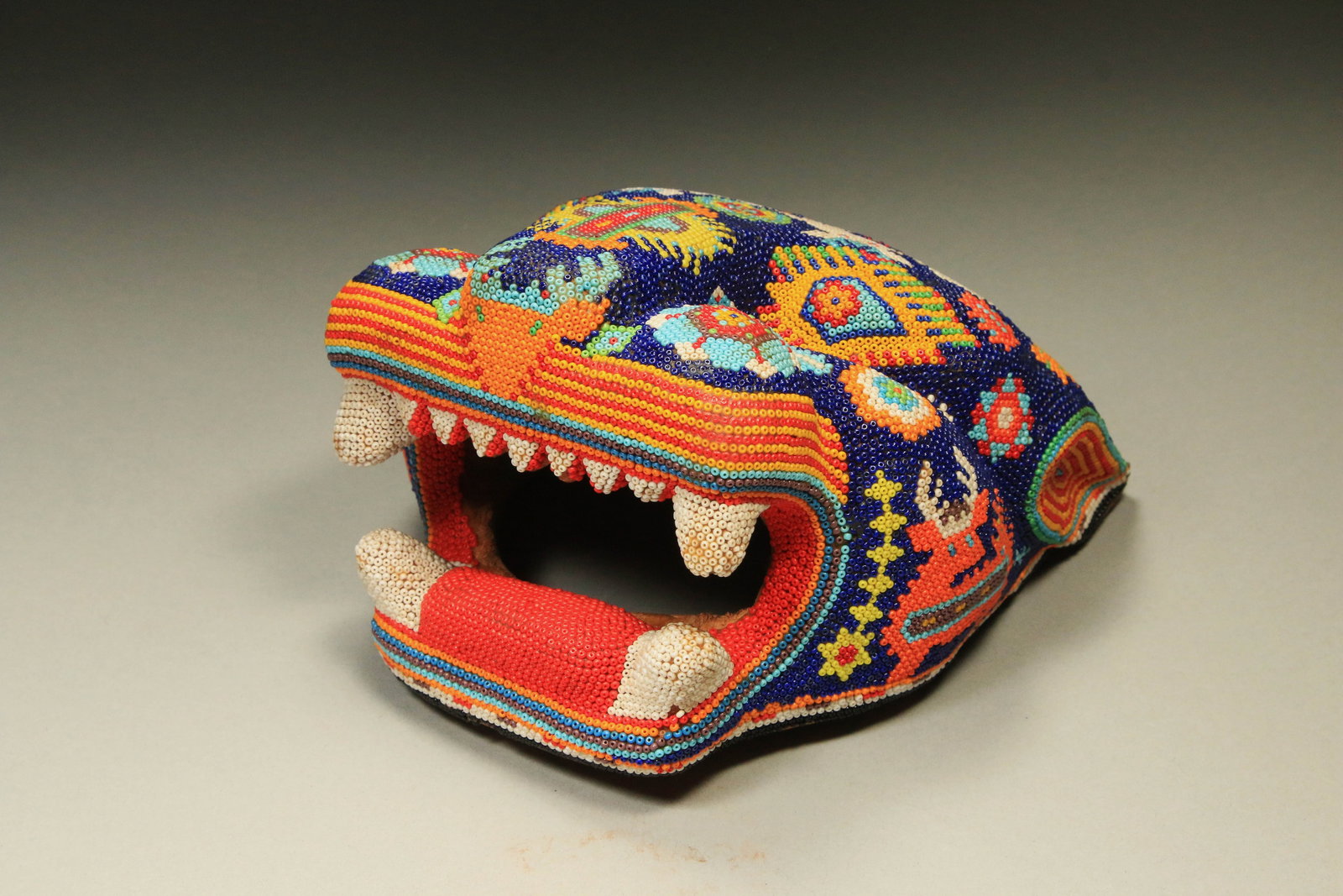Native American Huichol Jaguar Head: A beaded Jaguar Head with open fanged mouth. Contact Auction House for discounted in-house shipping quote