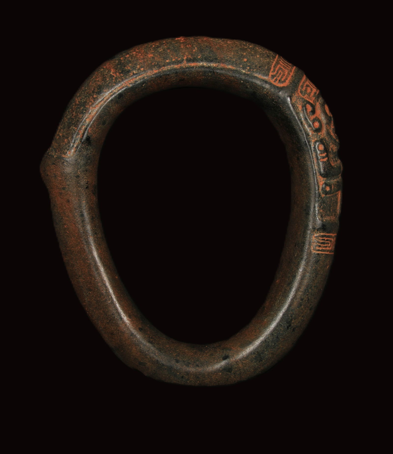 Pre-Columbian Taino Stone Yoke: Ovoid shape of different thickness with a Zemi figure on one side and a protrusion of opposite. 11" x 9". Provenance: Ex collection D. Purca, New York, N.Y. Taino yokes are carved stone versions of hi