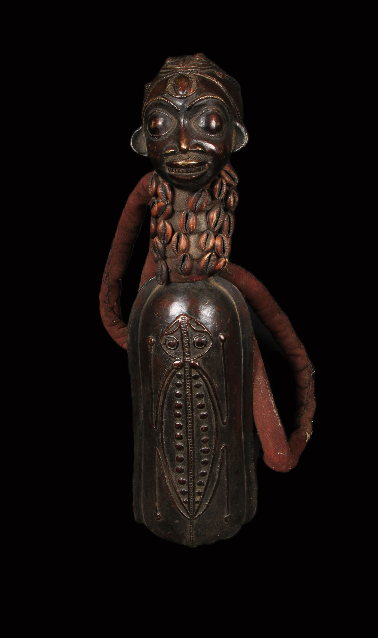 African Art Cameroon Bronze Gong: A vintage ceremonial bronze gong with classic Bamileke face, shells at neck, insect design on body, fiber handles, Cameroon. 19" H. Provenance: Ex. A, Njoya acquired from Kahan Gallery, 1984.