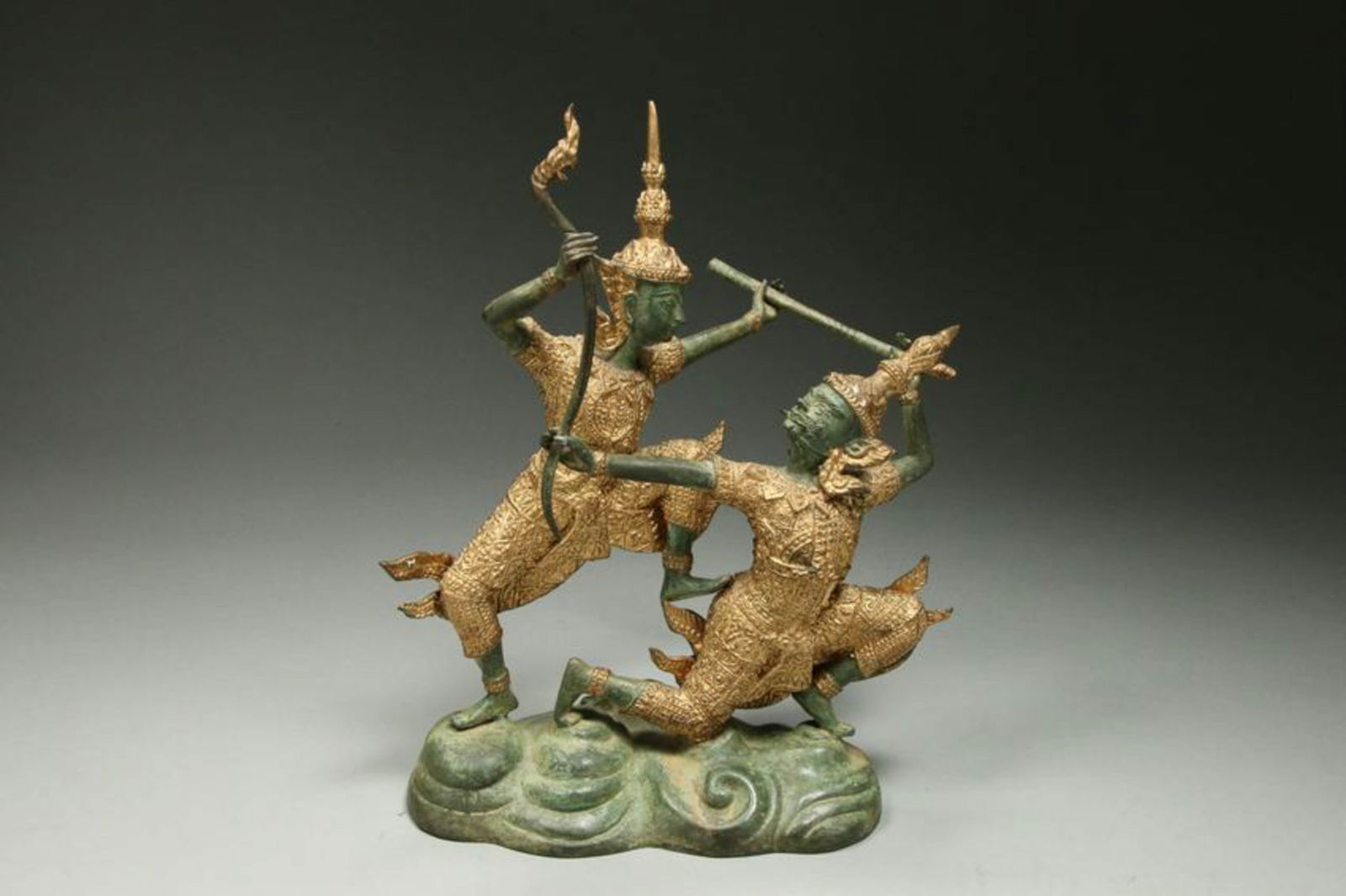 Thai Metal Statue of Dancers: A mixed metal statue of dancers in costume, holding staffs. 9" x 7-1/2""