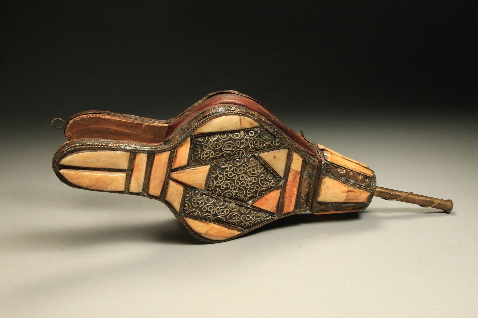 Moroccan - Camel Bone Bellows: A 19th century bellows with camel bone inlay. Intricate metal work trim. Still functions. 15" L.