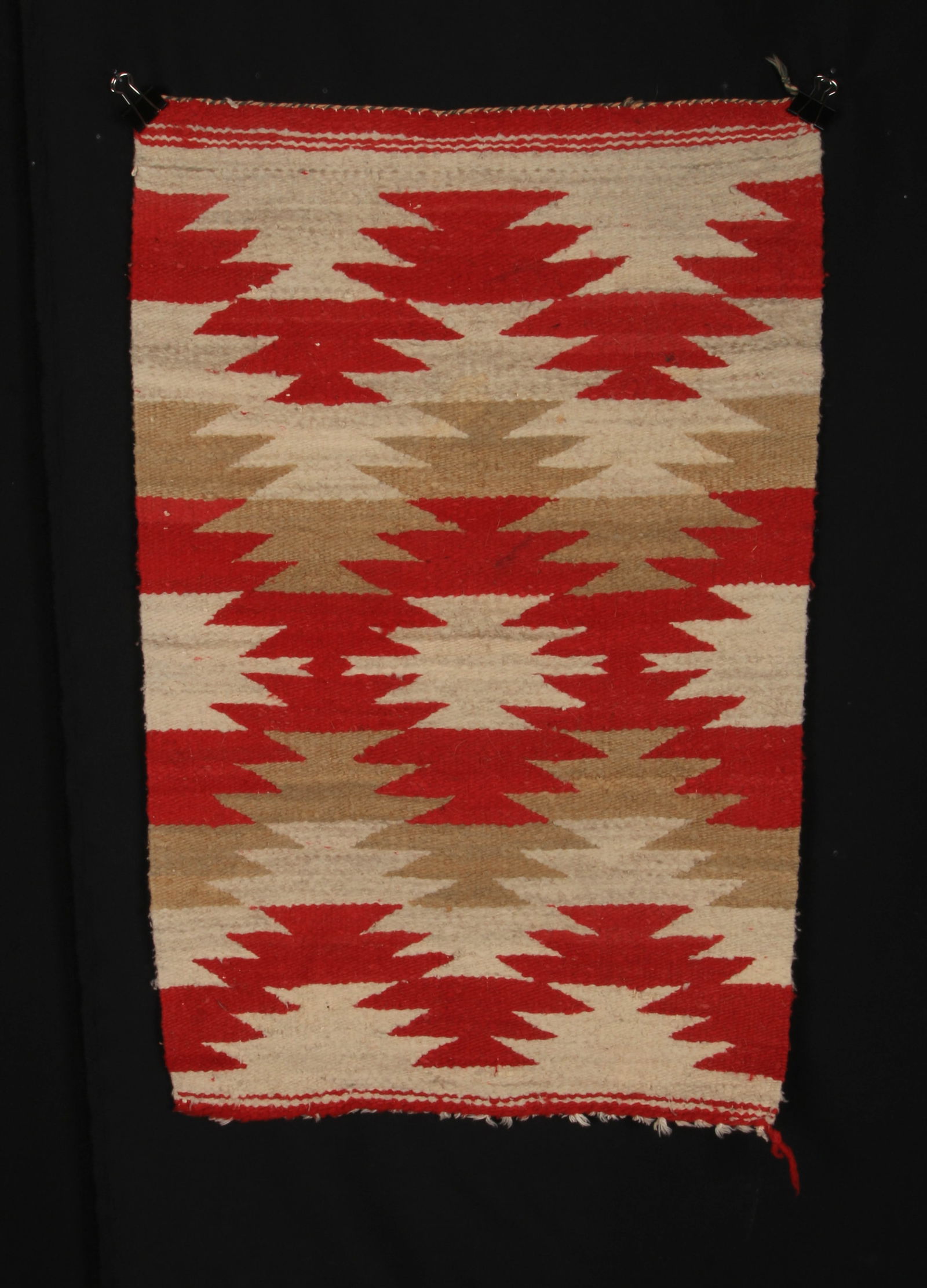 Native American Navajo Saddle Blanket: A handmade wool saddle blanket with geometric design. 21" x 32".