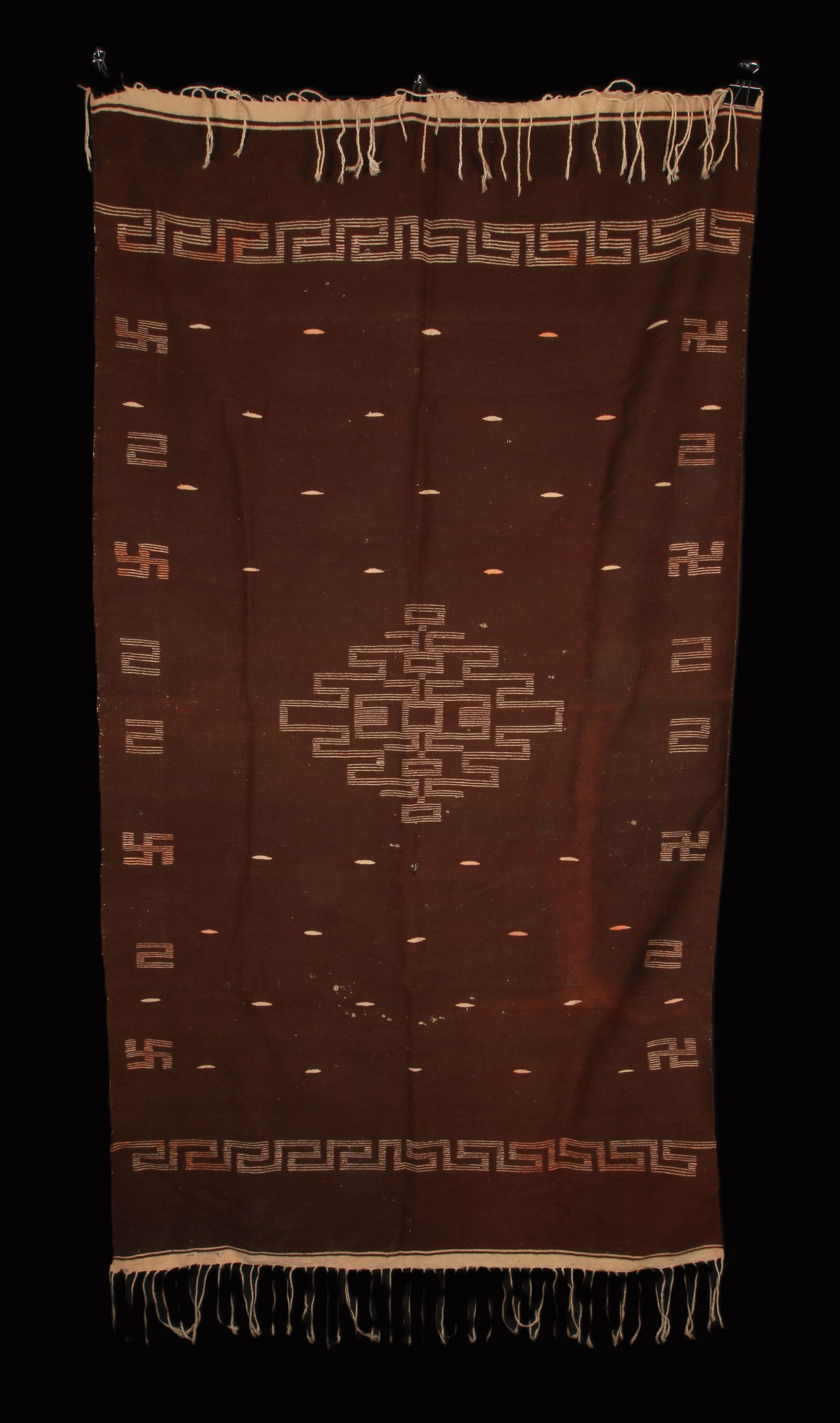 Native American Textile: A Native American throw with a swirling log design. 42" x 77".