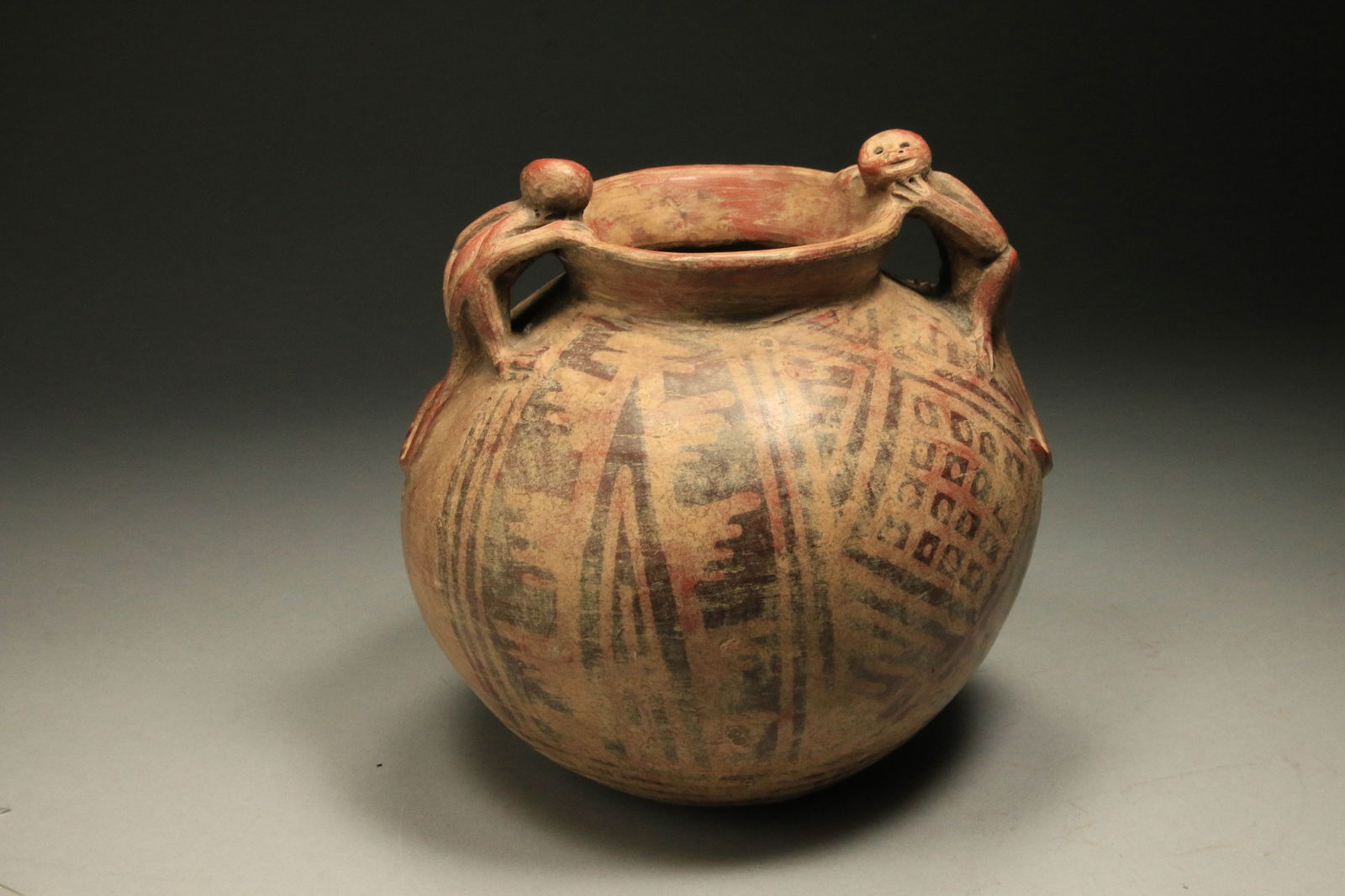 Philippines Bulul Guardian Statue: A small wood Bulul rice guardian figure with container between legs for offerings to the Rice Gods. 8" H