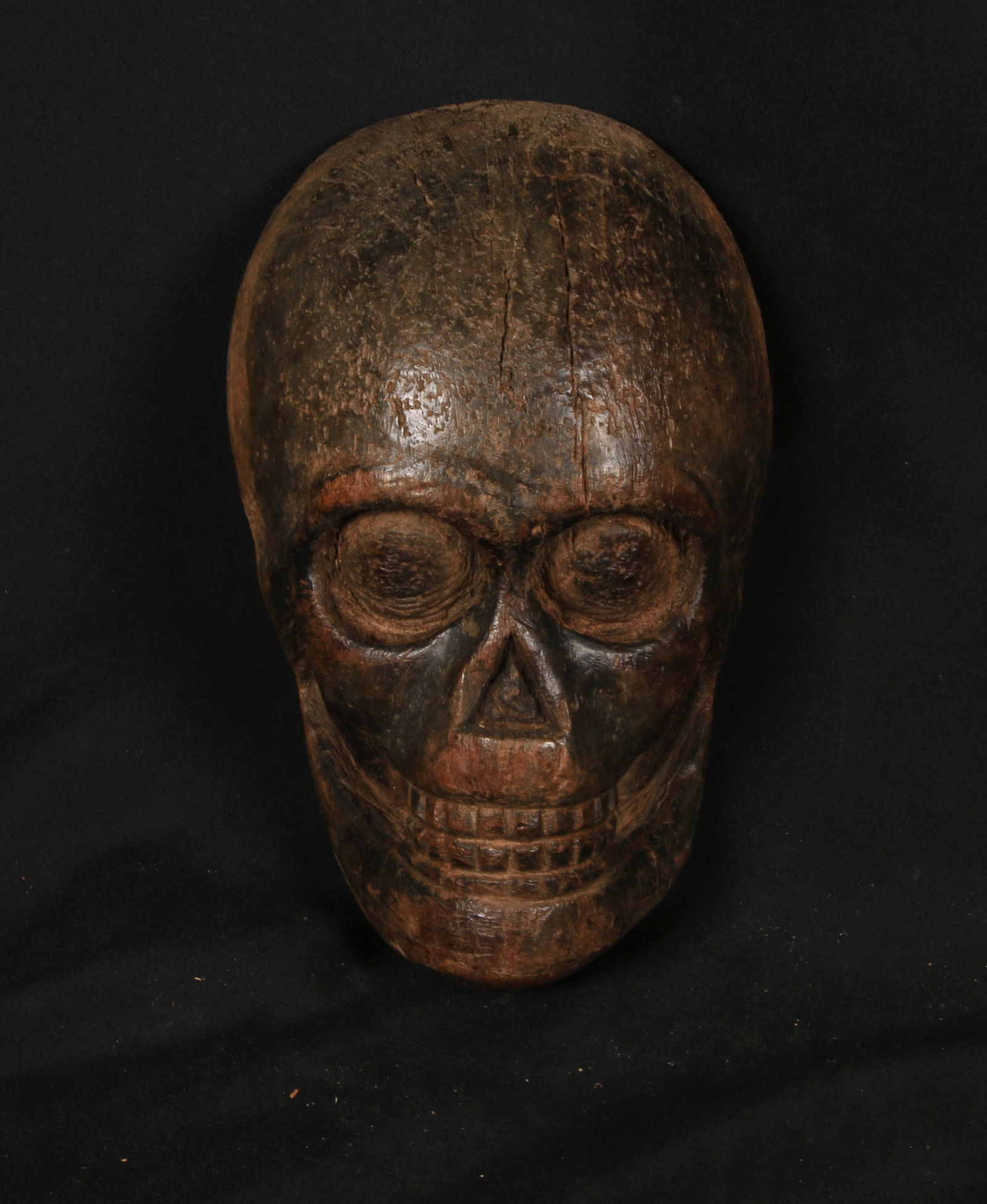 Paper Mache Mold: A wood paper mache mold of a skull. 8" H