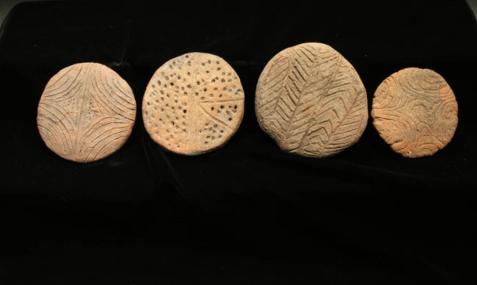 Pre-Columbian Taino Stamps & Star chart Lot of 4: Lot of 3 round terracotta body stamps and a star chart. Three have designs on both sides. 2" - 3" dia. Provenance: Ex collection Tony Milton, NM.