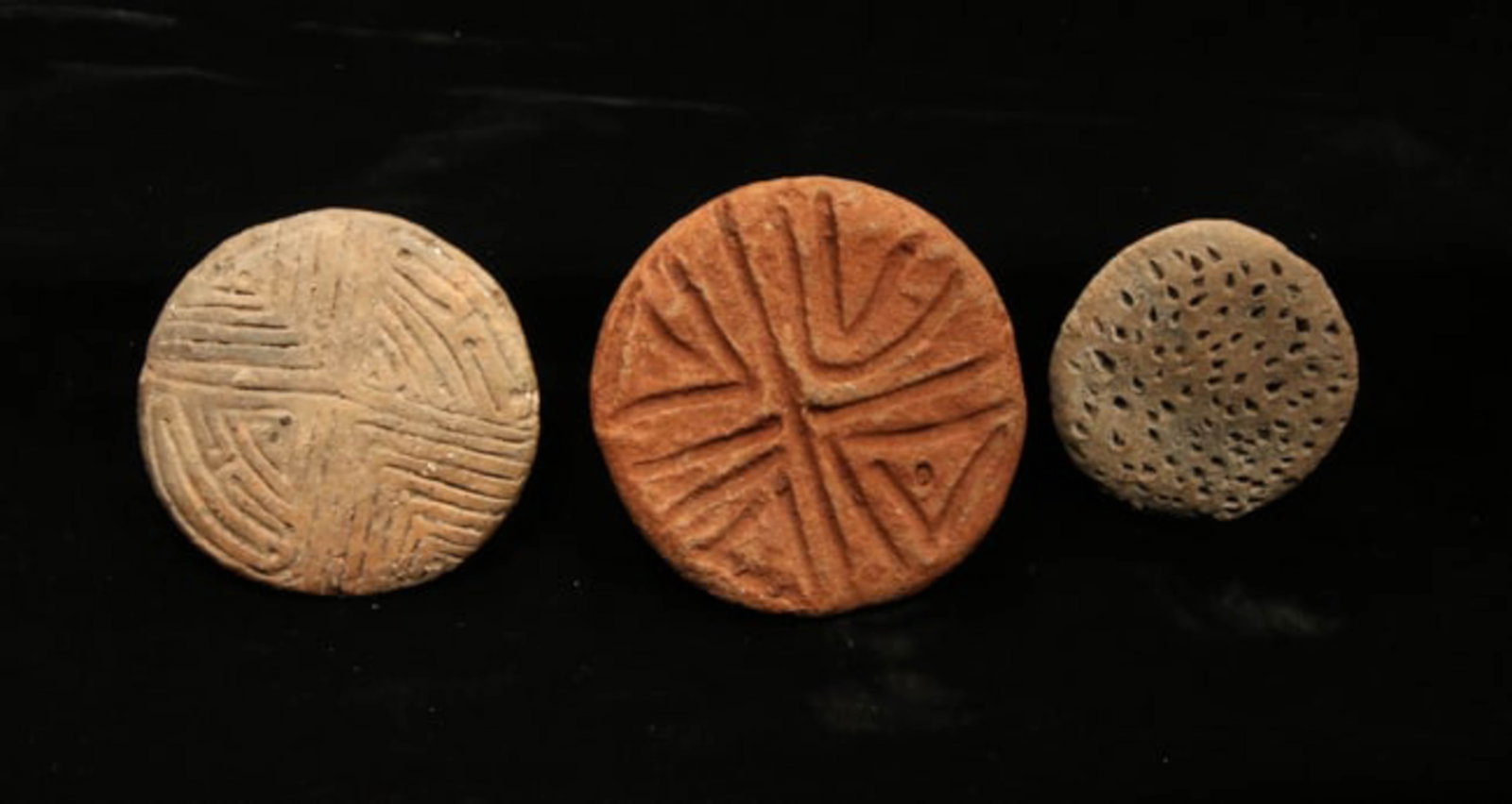 Pre-Columbian Taino Stamps and Star Chart: Lot of 2 Taino terracotta circular body stamps and a circular star chart. 2-1/2" - 3" Dia.