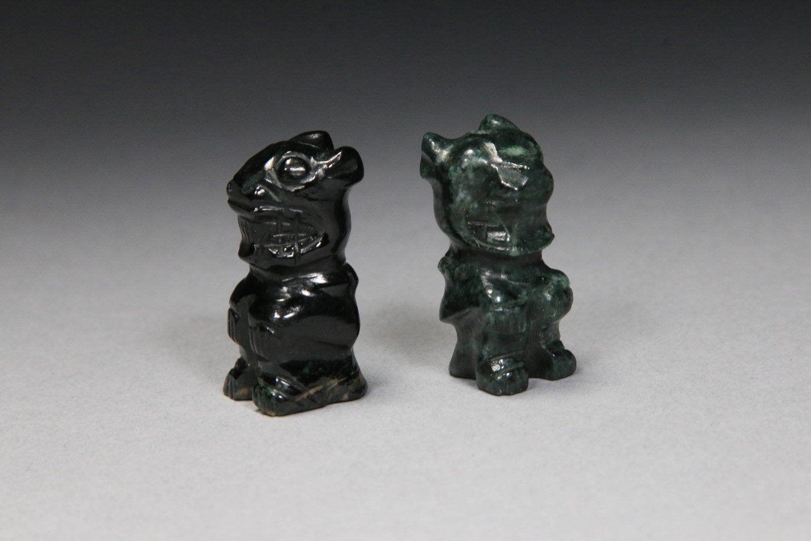 Hand-carved Jade Jaguars - Lot of 2: A dark green and black jade jaguar figurines, carved from jade from the Montagua River Valley, Guatemala. 1-1/4"" H.