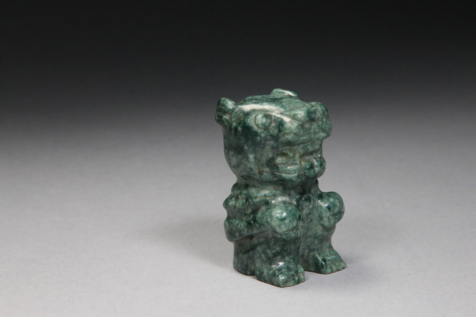 Hand-carved Green Jade Jaguar: A dark green jade jaguar figurine, carved from jade from the Montagua River Valley, Guatemala. 2-1/8" H.