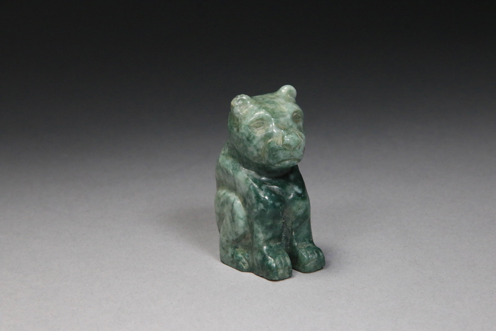 Hand-carved Green Jade Jaguar: A light green jade jaguar figurine, carved from jade from the Montagua River Valley, Guatemala. 2" H.
