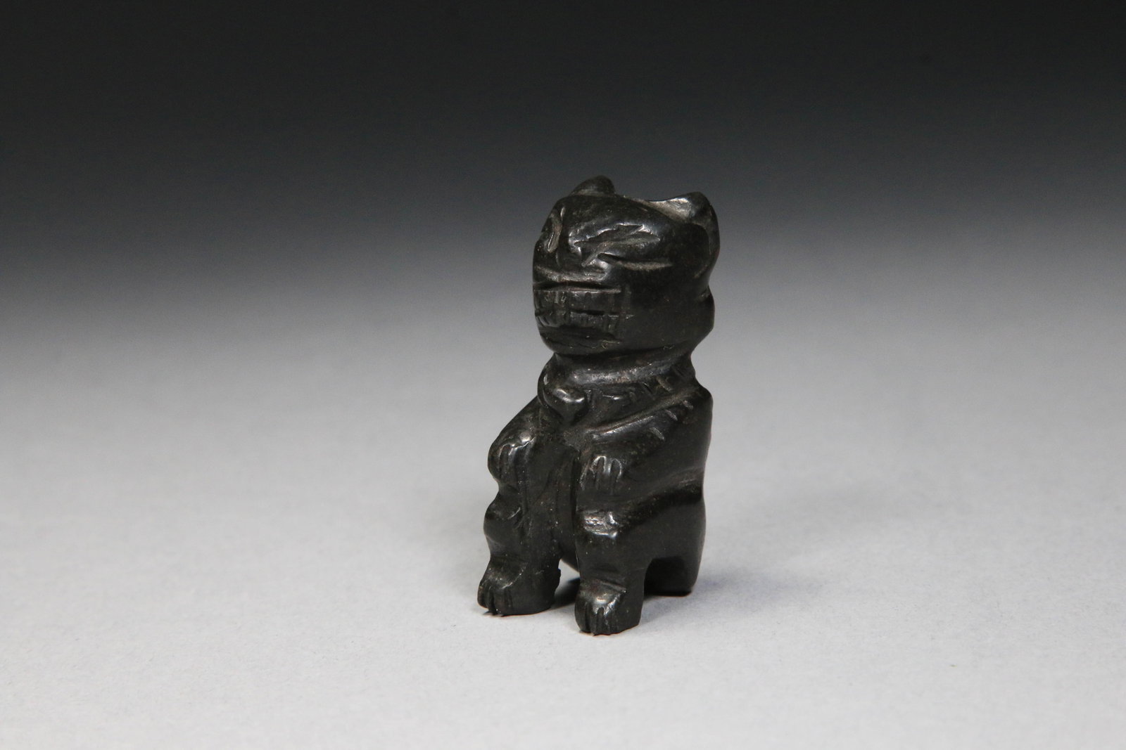 Hand-carved black Jade Jaguar: A black jade jaguar figurine, carved from jade from the Montagua River Valley, Guatemala. 1-3/4" H.