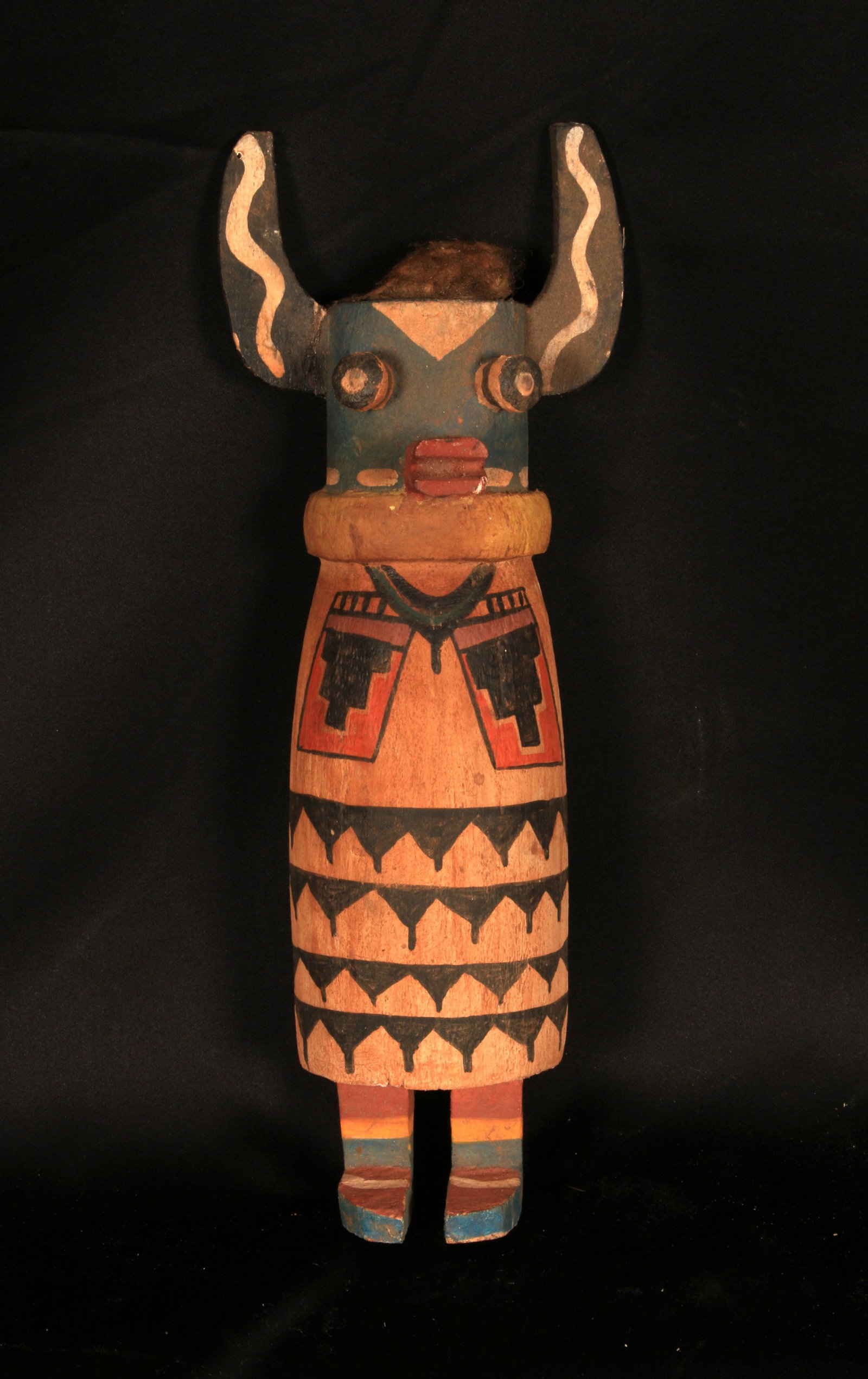 Native American Katsina Doll: Hopi Cow Kachina doll, also known as a Wakas Katsina. Carved from cottonwood and painted with mineral pigments. 15" H. Provenance: Ex. Collection Pedro Gonzalez, CA. The figure features prominent horn