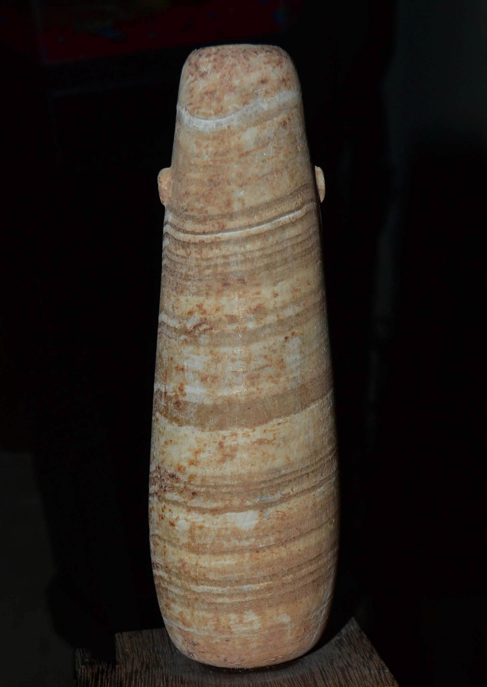 Ancient Egyptian Alabastron: The long, conical shaped, tapering body with prominent horizontal bands and lug handles. Late Period, 26th-30th Dynasty, 688-343 B.C. 6-1/4 inches high. Mounted. Some photos illuminated. Purchased on