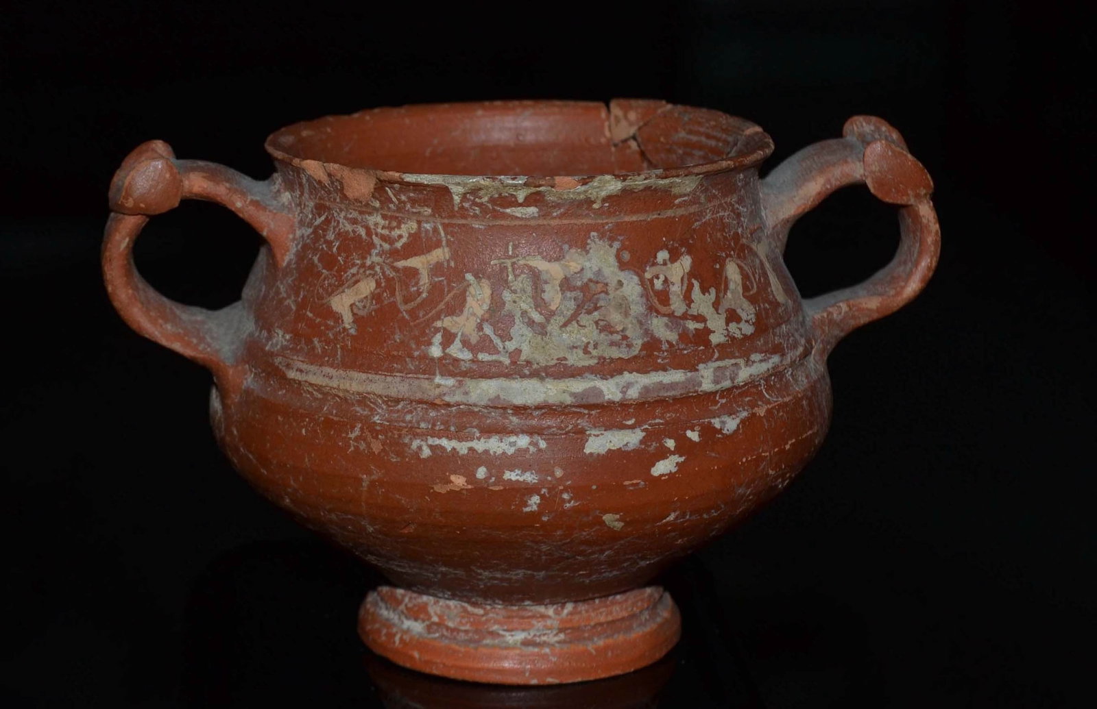 Ancient Greek Wine Cup: Deep vase with two vertical handles, used in ancient Greece to drink wine. Small handles are decorated with double top disc. The belly widens sharply before narrowing towards the small round foot. Bet