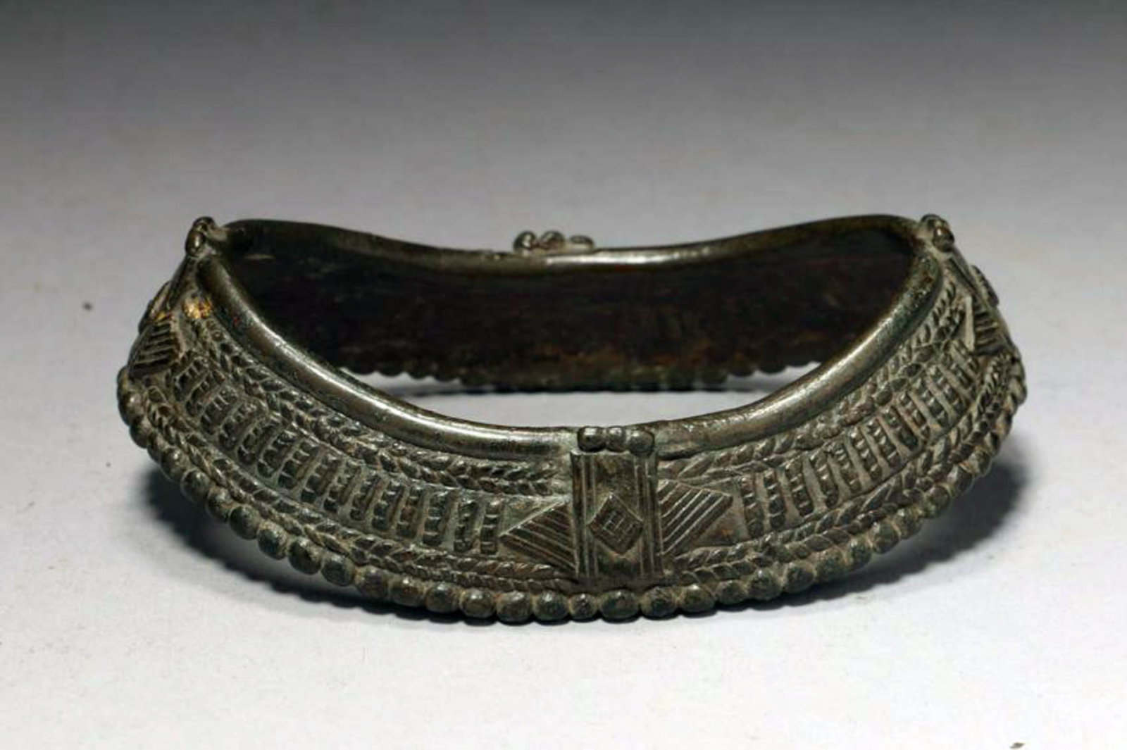 Bronze Ankle Bracelet: A bronze ankle bracelet, 1100 A.D. wit high relief design. 5" L Provenance: Ex collection, NYS