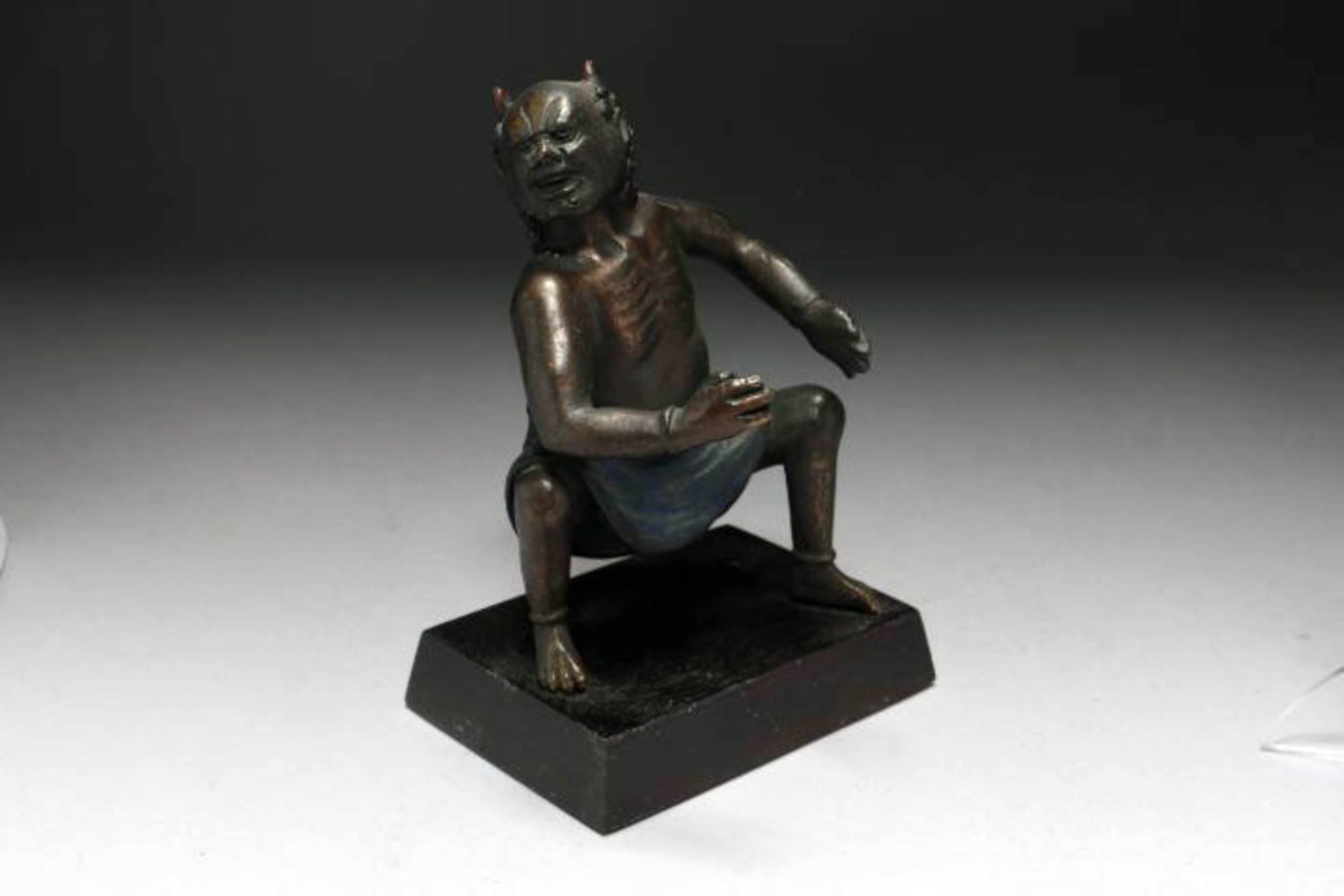 Japanese Bronze Demon: A Meiji period bronze demon with cold painted skirt. 5" H (w/o base)