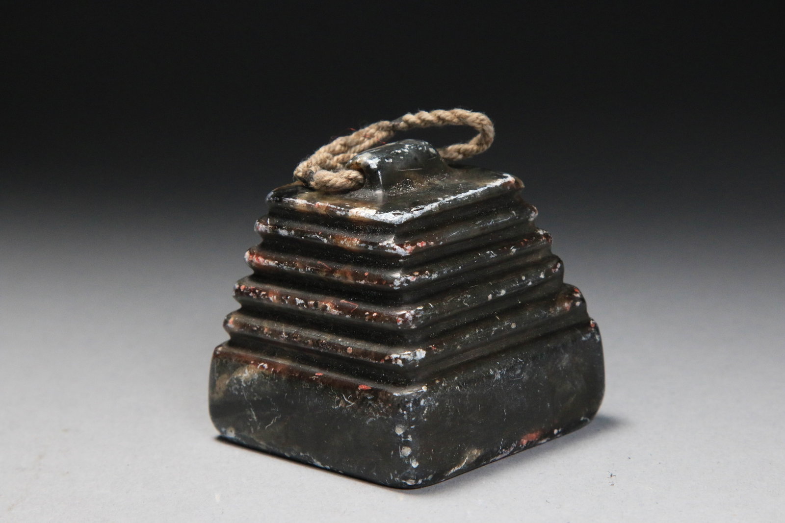 Chinese Soapstone Seal: Chinese soapstone stamp in steeped pyramid shape. It features a distinctive tiered or stepped pyramidal design, which is to as a "Saqqara" style, resembling the ancient Egyptian step pyramid. Suspensi
