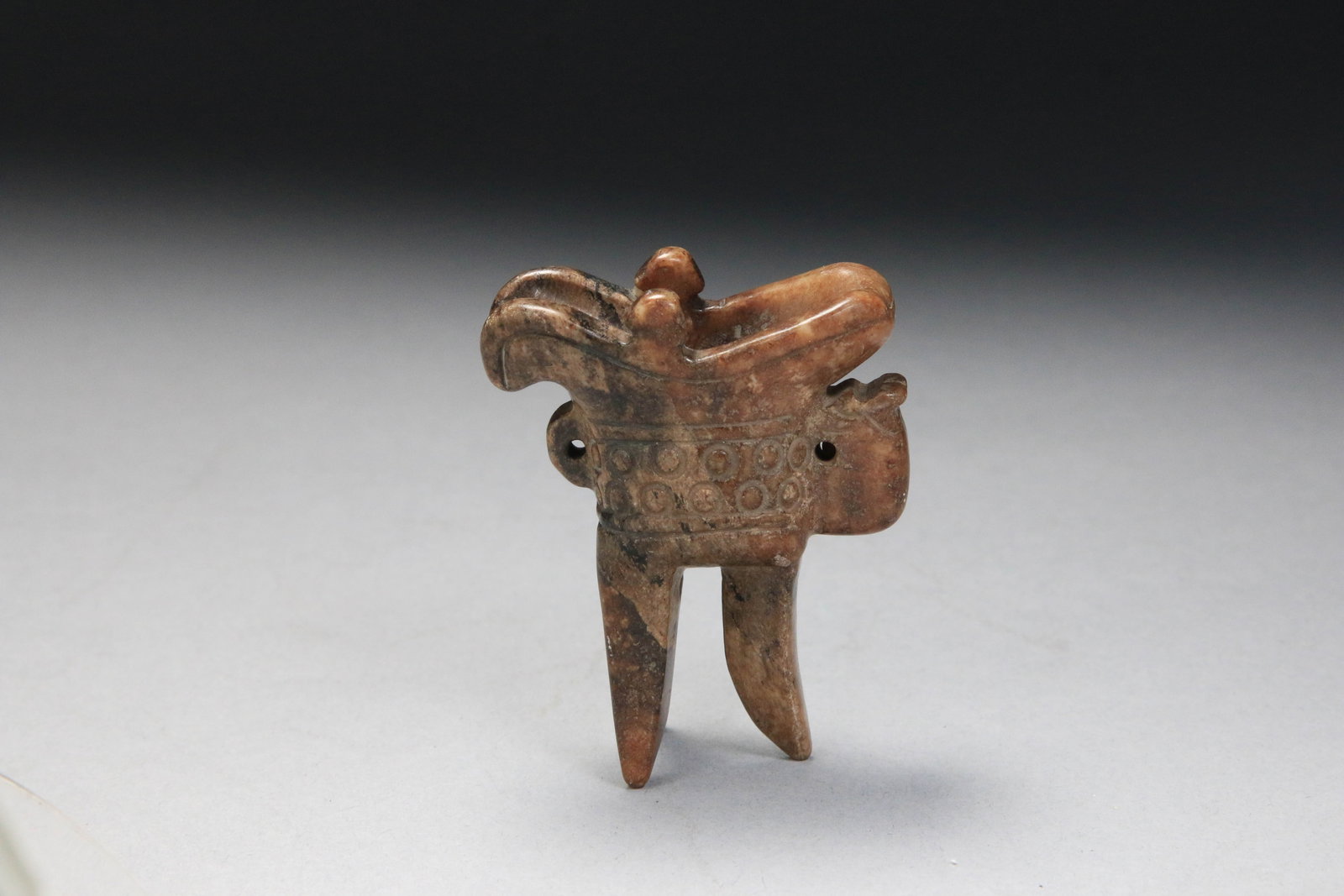 Chinese Jade Ritual Vessel: A small brown jade wine vessel, "Jue". Classic jue shape, which includes a spout, a pointed tail, two small posts (called zhu) on the top rim, a single side handle, and three long, tapering tripod leg