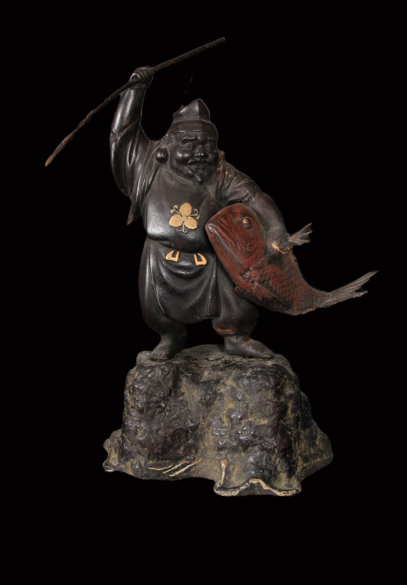 Large Japanese Bronze figure, Ebisu, the Japanese god of fishermen and luck.: Japanese Meiji period (1868-1912) solid bronze okimono of Ebisu (lucky god of fishermen ), emblem on chest, with a fishing spear ( removable) and holding a fish with inlaid eyes and fine details and c