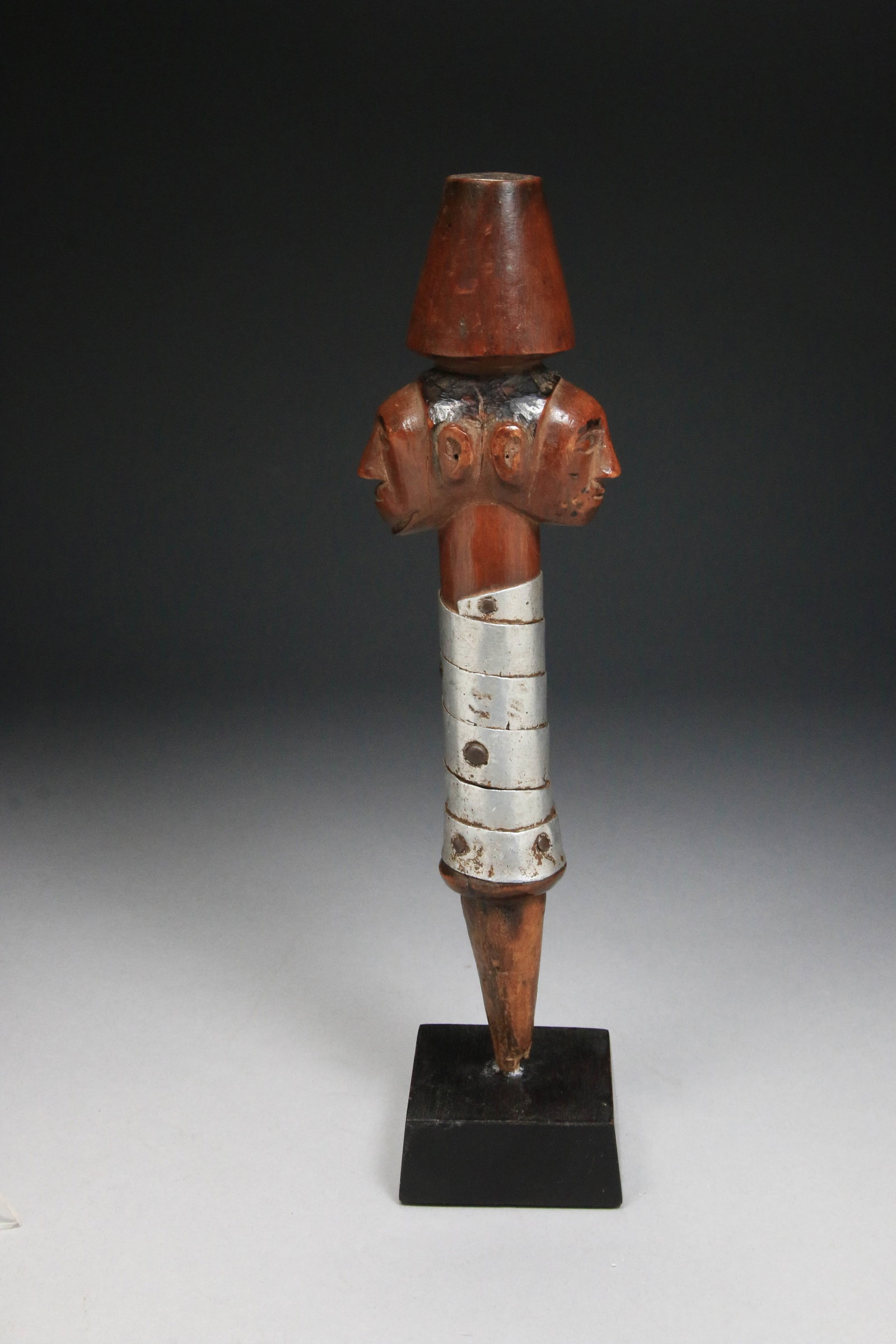 African Art - Luba Prestige Scepter 19th Century: A wood and metal Janus-faced prestige scepter or staff of office, known as a kibango, from the Luba people of the Democratic Republic of the Congo. 10" L. Display stand is included. Provenance: Ex. co
