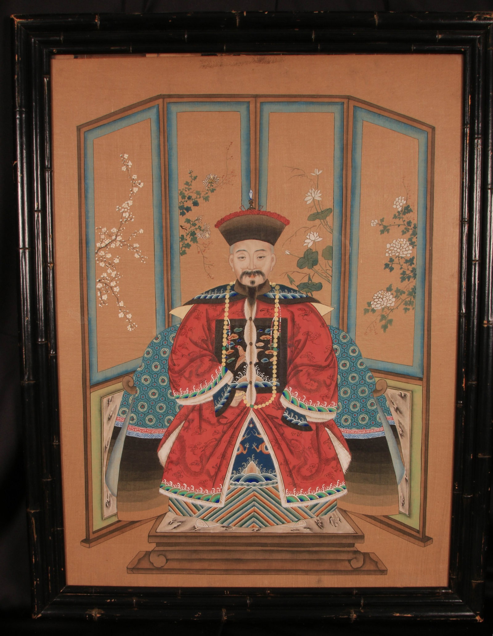 Chinese Ancestor Portrait - Qing Dynasty: The painting depicts a high-ranking official or Mandarin dignitary in formal court attire. The dignitary is seated wearing a red court robe with a rank badge (often featuring a crane or other symbolic