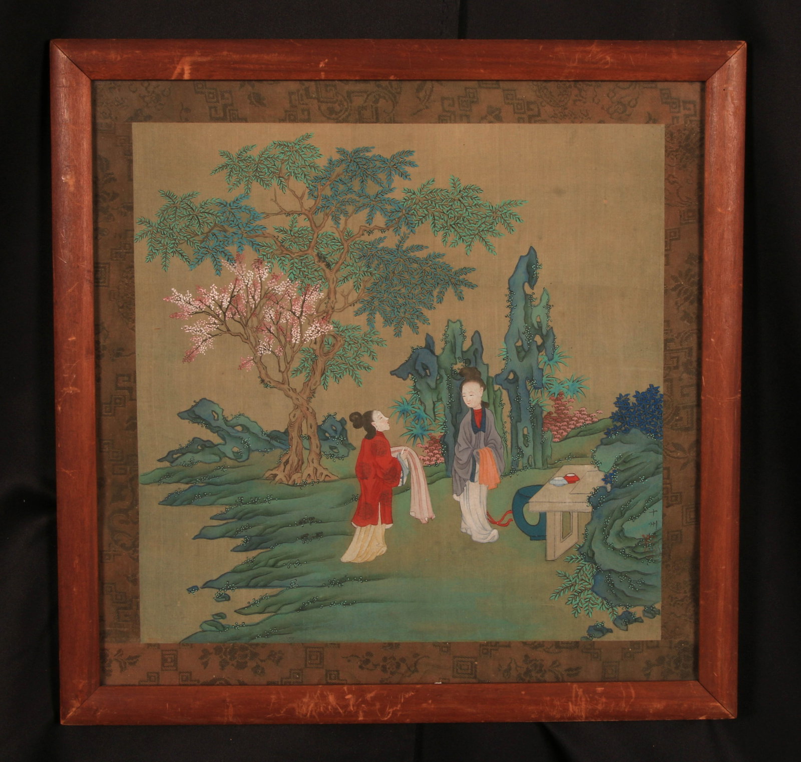 Chinese Silk Painting - Qing Dynasty: The painting features two figures in a garden setting, rendered in a style that emphasizes classical vignettes of human interaction amidst nature. The painting utilizes a "blue-green landscape" palett