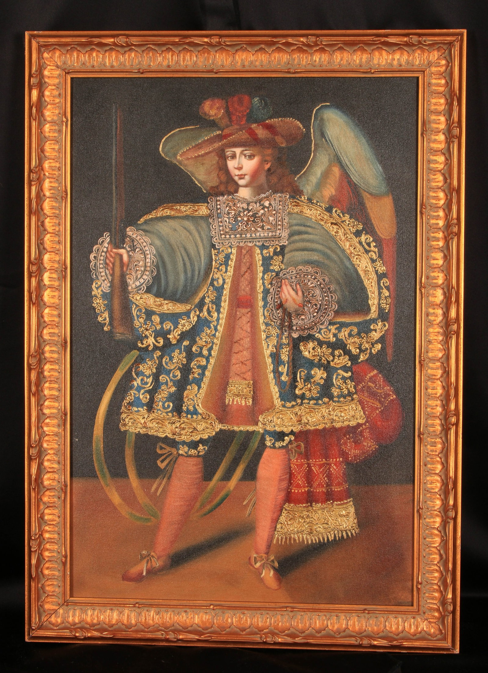 Framed Oil Painting Cuzco School: A painting of an Archangel Arcabucero (Arquebusier Angel), a distinctive style of religious art from the Cuzco School (Escuela Cuzqueña) of Viceregal Peru. 27" x 19"