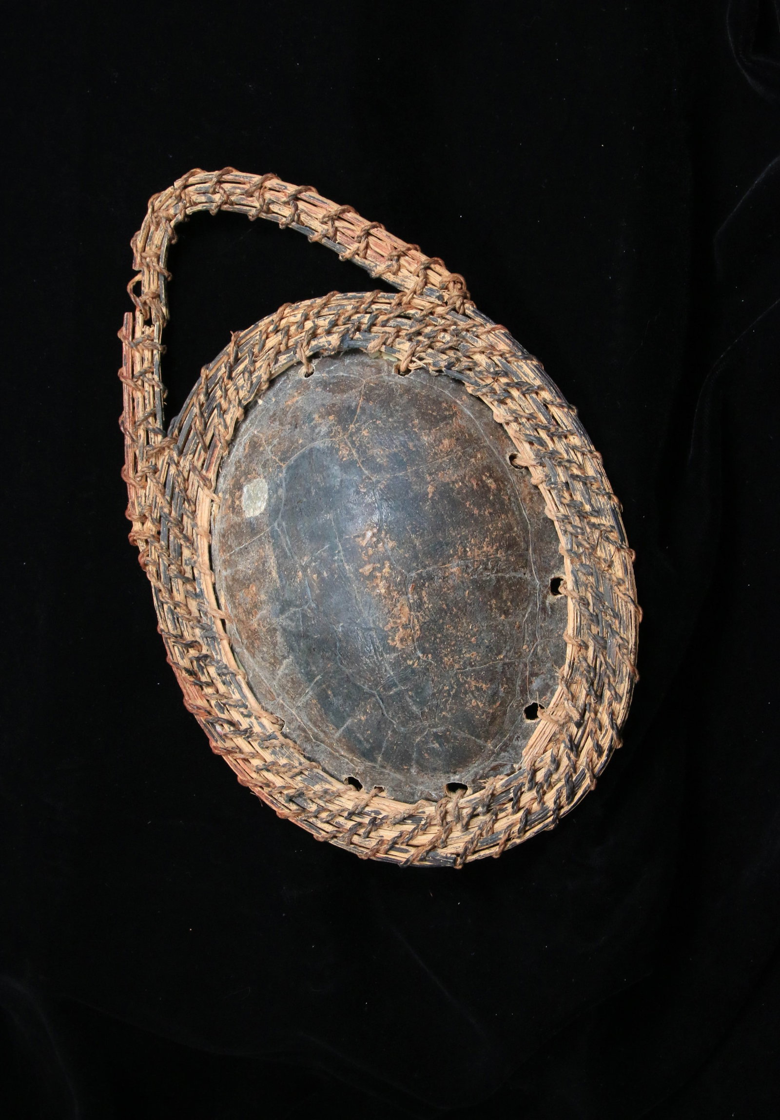 Papua New Guinea Turtle Shell Adornment: A Sepik River turtle shell adornment with braided fiber. 9" L.