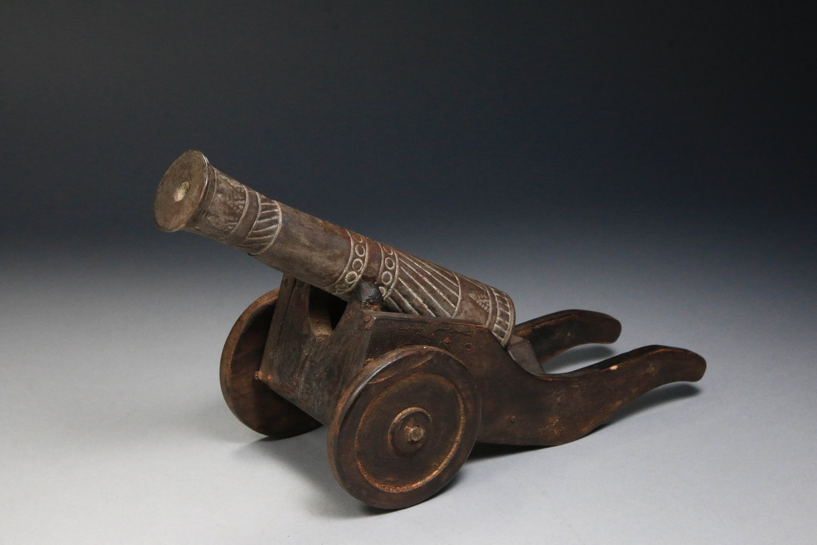 Philippines Lantaka Cannon: A small Lantaka cannon, bronze cannon mounted on a wood wheeled frame. 10-1/4" L.
