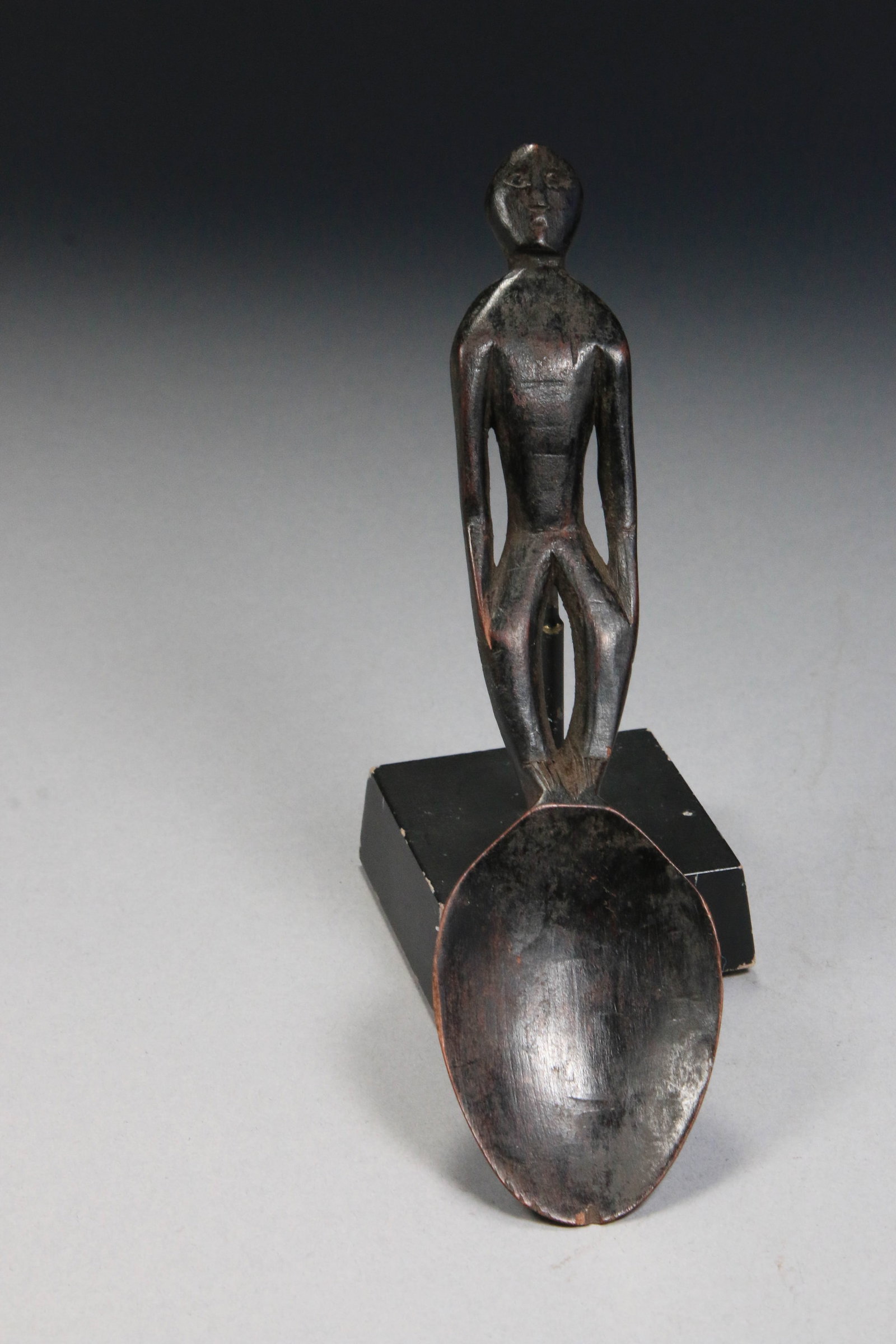Philippines Ifugao Tribal Spoon: The handle is carved from wood in the form of a standing human figure known as a bulul or bin-nullol, which serves as a protective guardian deity. 11" L. These ceremonial spoons were used for cooking 