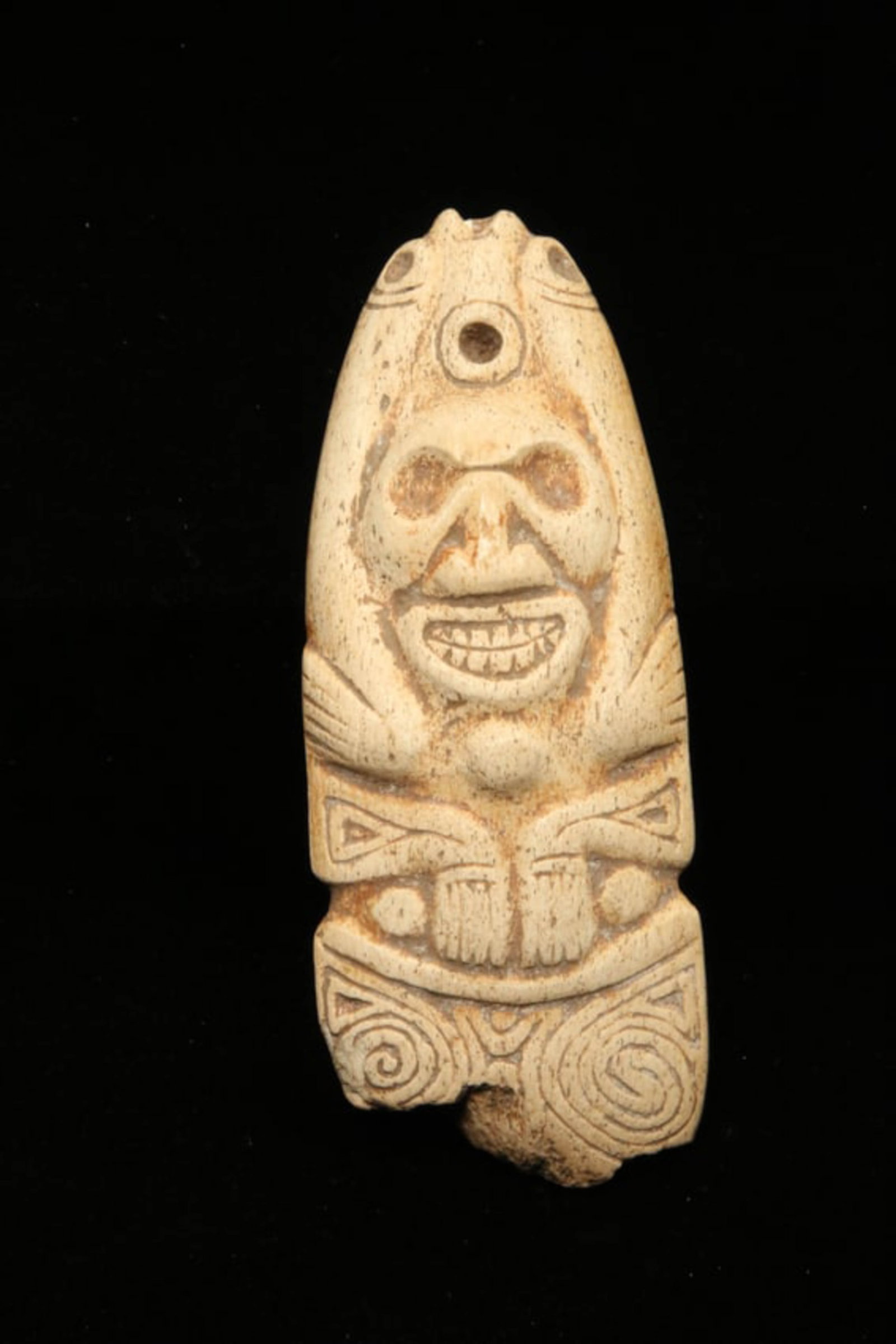 Pre-Columbian Zemi Bone Carving: A manatee carved bone of a Zemi deity. 4-1/2" L. Provenance: Ex collection Tony Milton, NM.