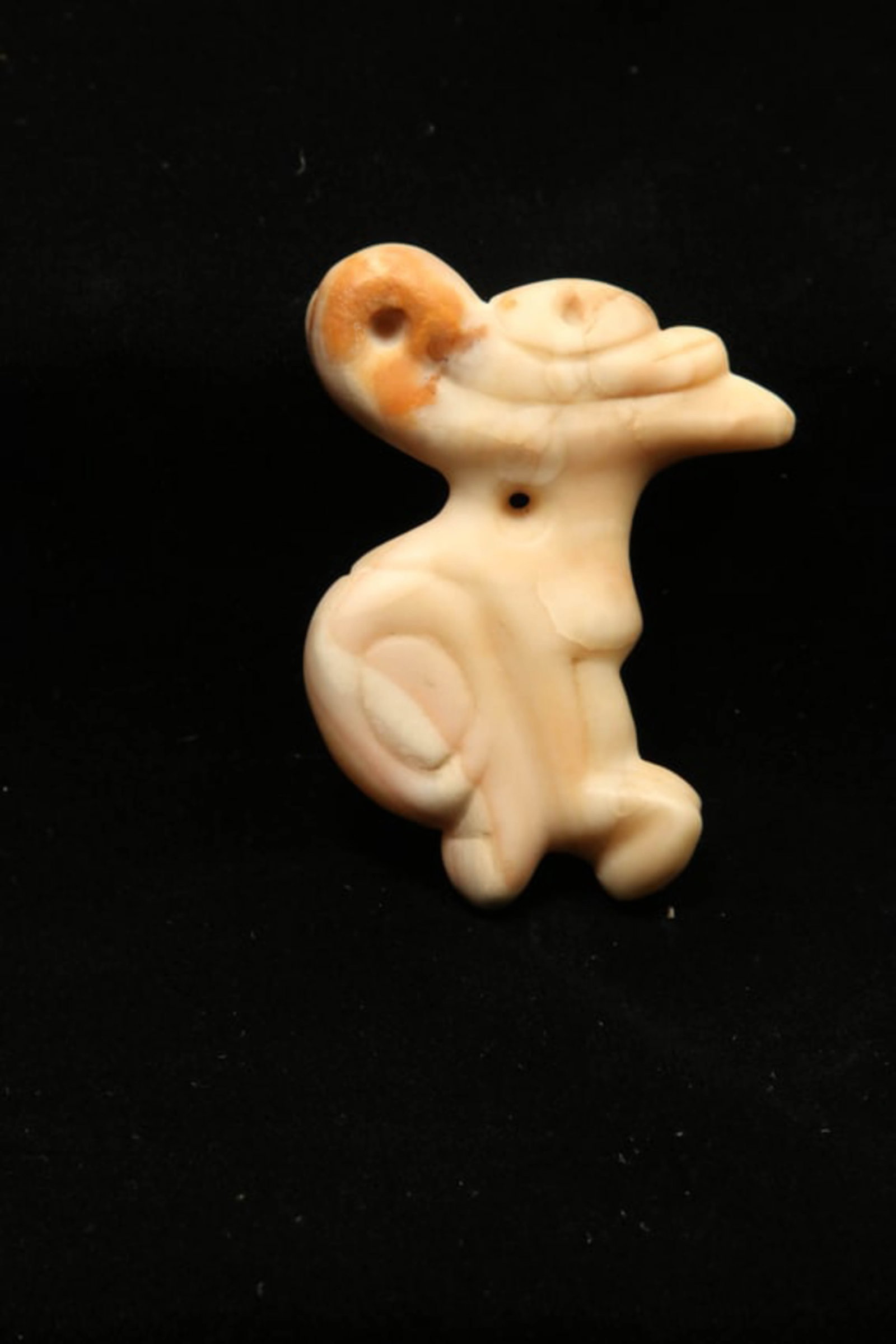Pre-Columbian Stone Bird Amulet: A Taino cream colored stone amulet in the shape of a bird with suspension hole at neck. 3" L Provenance: Ex collection Tony Milton, NM.