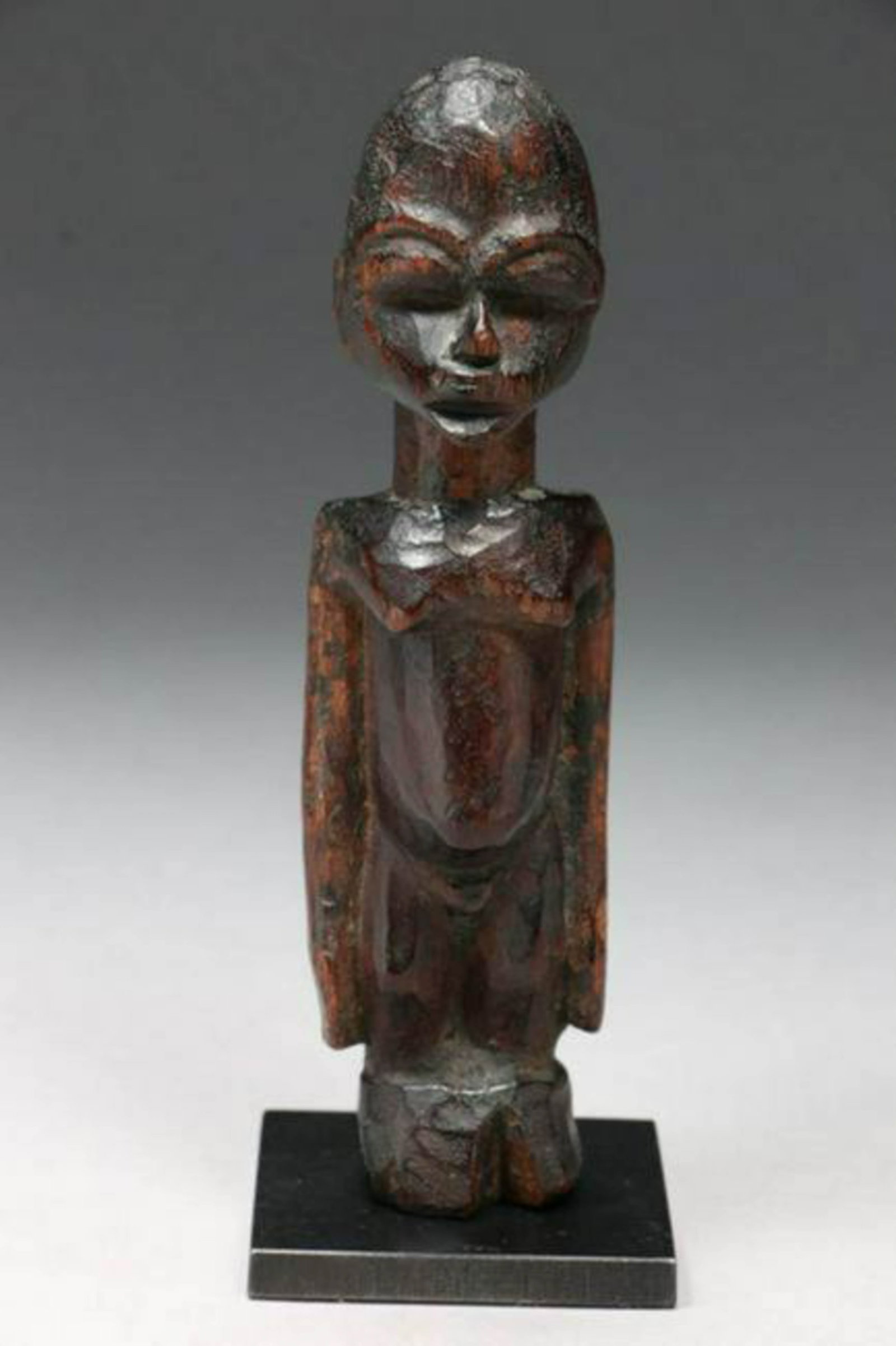 African Art Lobi Statuette: small Lobi wood statue, great patina. Display stand included. 5-7/8" H Provenance: Ex private collection, NY