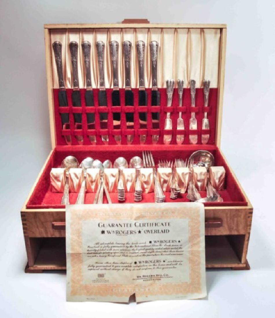 WM Rogers Silver Plated Silverware Set: Complete Service for 8 silver plate WM Rogers in velvet lined case (missing drawer). Includes : three serving spoons, fork and spoon for salad, gravy spoon, sugar spoon, butter knife, eight dessert kn