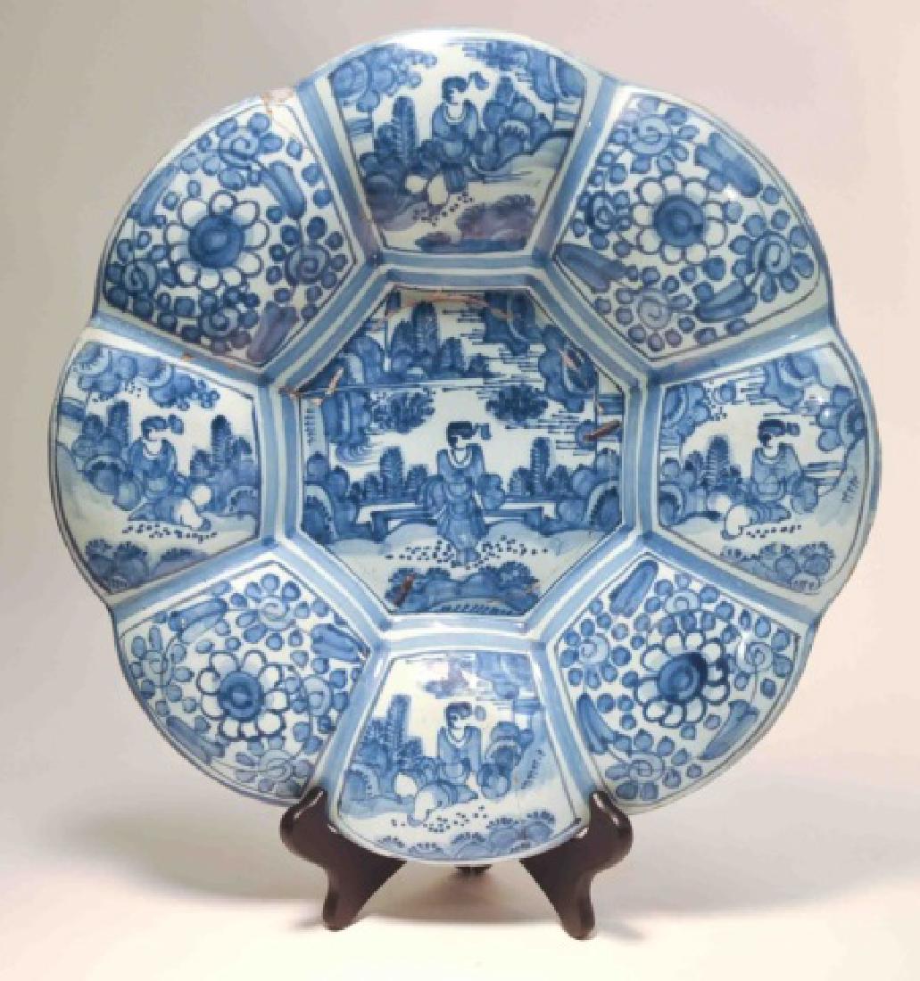 17th Century German Faience Blue Lobed Dish: German faience lobed blue and white dish c. late 1700, decorated in under glaze blue in the Chinese Transitional style. Frankfurt factory: Manganese group, Diameter: 12 inches
