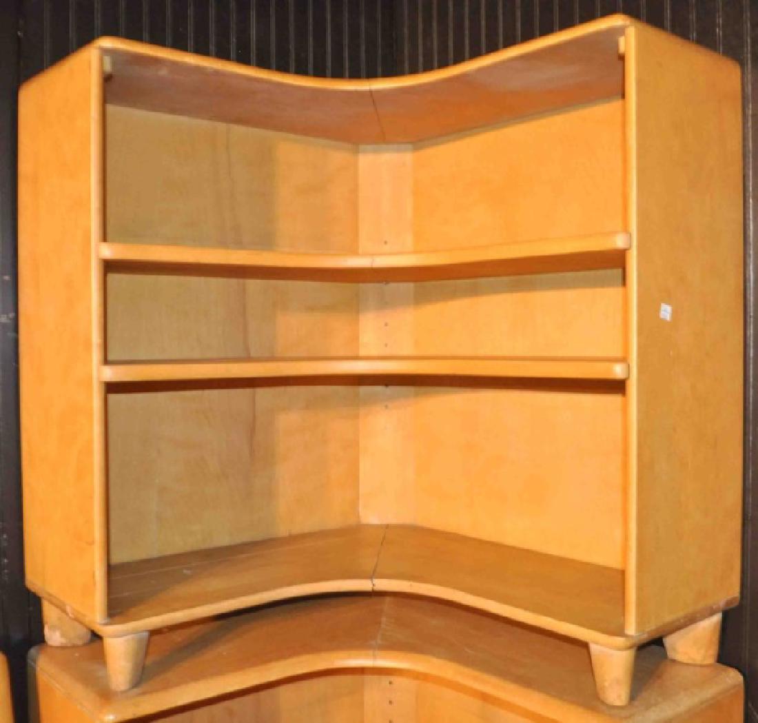 Mid Century Heywood Wakefield Corner Bookcase: Heywood Wakefield specializes in Mid Century Modern appeal furniture. Wood is harvested from Northern Yellow Birch trees on sustainable tree farms. Corner bookshelf features 2 shelves that are adjusta