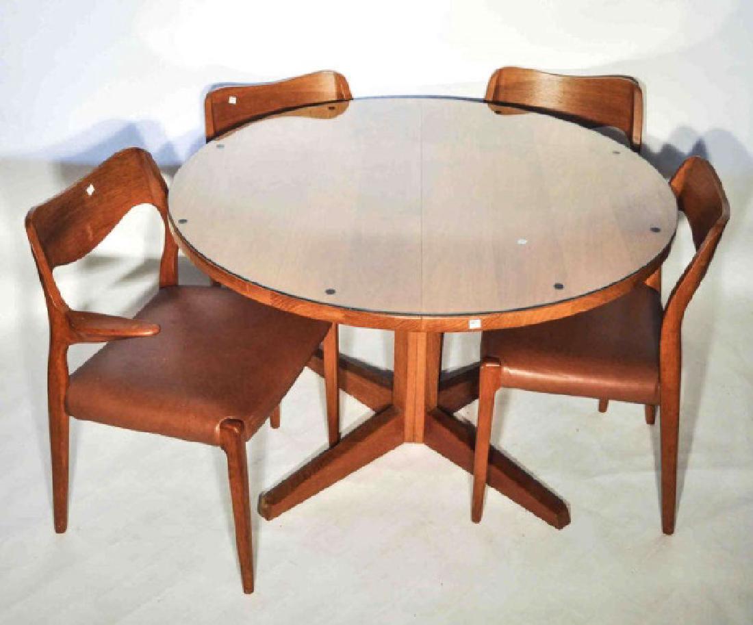 Danish Mid-Century Modern Teak Table & 4 Chairs: An original Great Mid-Century Danish modern Round Pedestal Teak Dining table and 4 chairs. The table features classic Norwegian MC style Features a glass top. Accompanied by 4 chairs, one arm chair. C