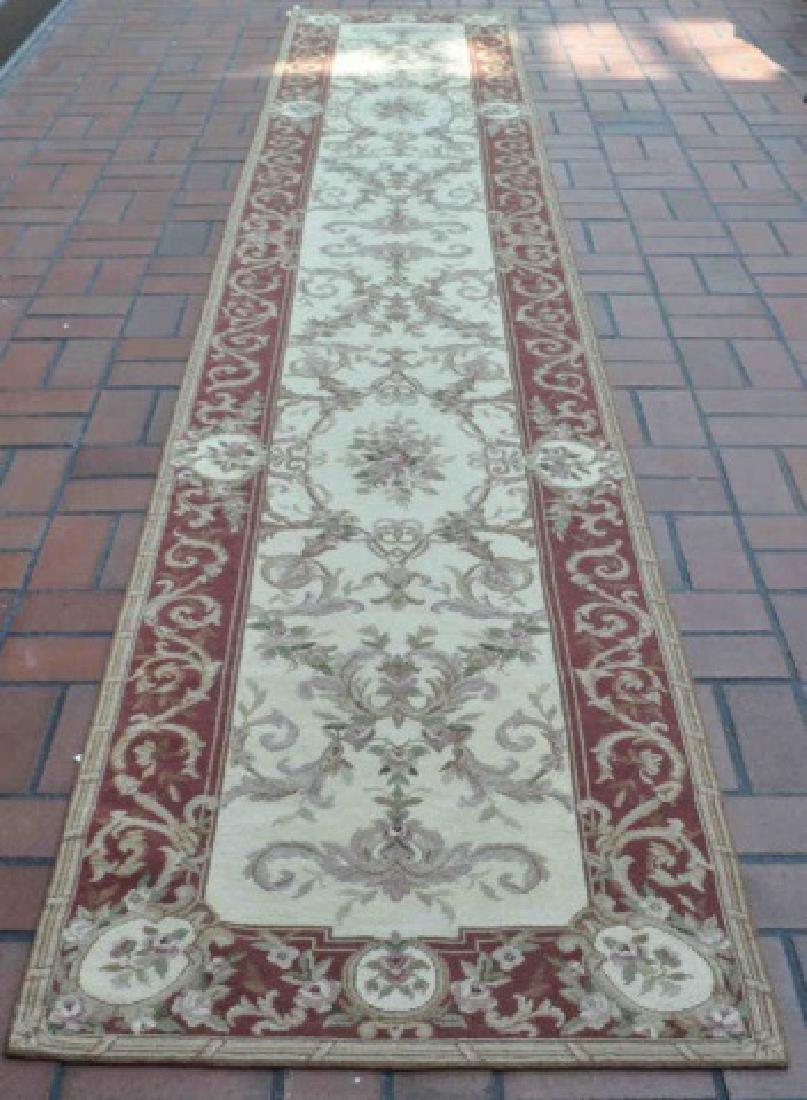 Handmade Needlepoint Tapestry Runner: Pleasing Handmade Needlepoint Tapestry Runner features neutral colors of Creams, tans and sports a darker border . 100% wool embroidery on 100% cotton canvas. It was made in China and measures 13' 6-1