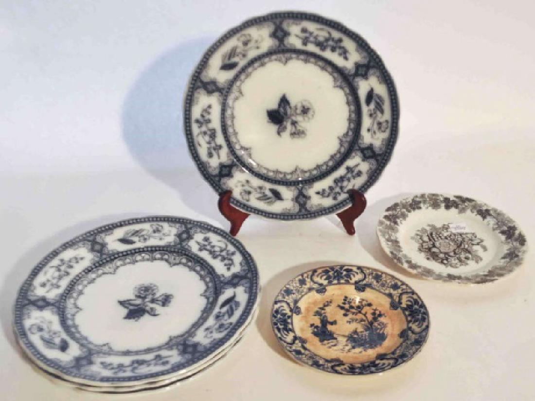 Antique Flow Blue Ironstone European Plates: Antique set of 4 flow blue plates marked with Speranza on the bottom. Remains in very good condition and measures 9 1/4 in diameter. Also included antique white and blue plate with Shanghai on bottom 