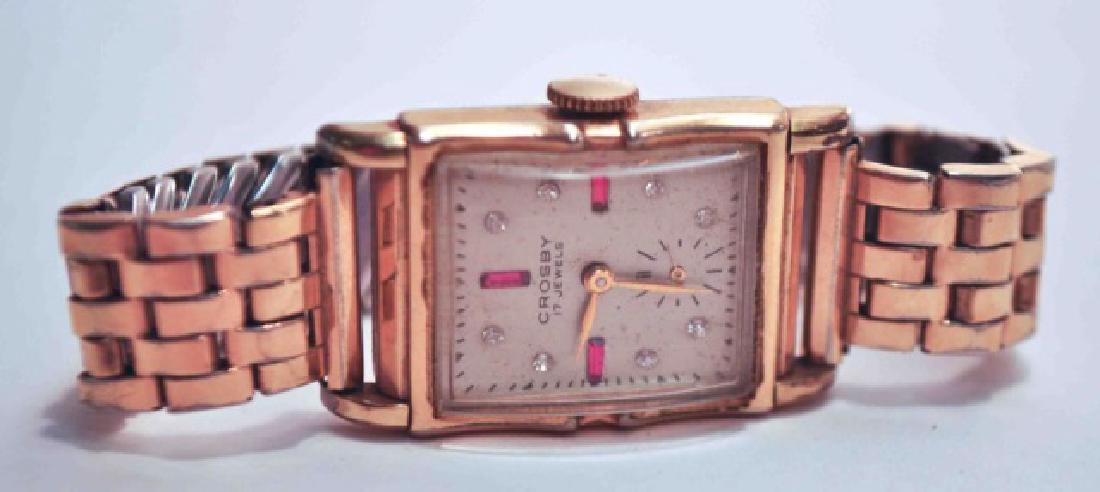 Vintage Crosby 17 Jewel Men's Gold Watch: This Classy and Elegant Vintage 14 Karat Gold Crosby 17 jewel watch would be a wonderful addition to your jewelry wardrobe. Can be taken from day time to evening! Rectangular Face with diamonds and ru