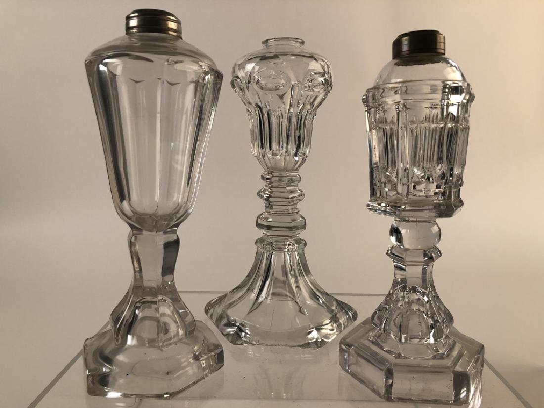Lot of 3 Unique Sandwich Glass Whale oil Lamps: Lot of 3 Sandwich Glass oil lamps. Different unique font patterns, 2 with collars. Approx. 9-1/2"tall. Polished, heavy and in excellent condition. Measures approx. 9 to 9-1/2" tall (CP-112)