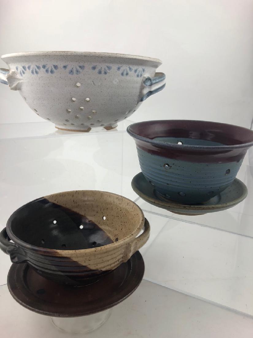 Lot of 3 Handthrown Pottery Colander/ Center Bowls: Stately lot of 3 Colanders/Berry Center bowls. All beautifully crafted. From the Everson Museum Director Sandra Trop's Private Collection. All in wonderful condition. Measures: 14", 9" & 7" wide. (JT-