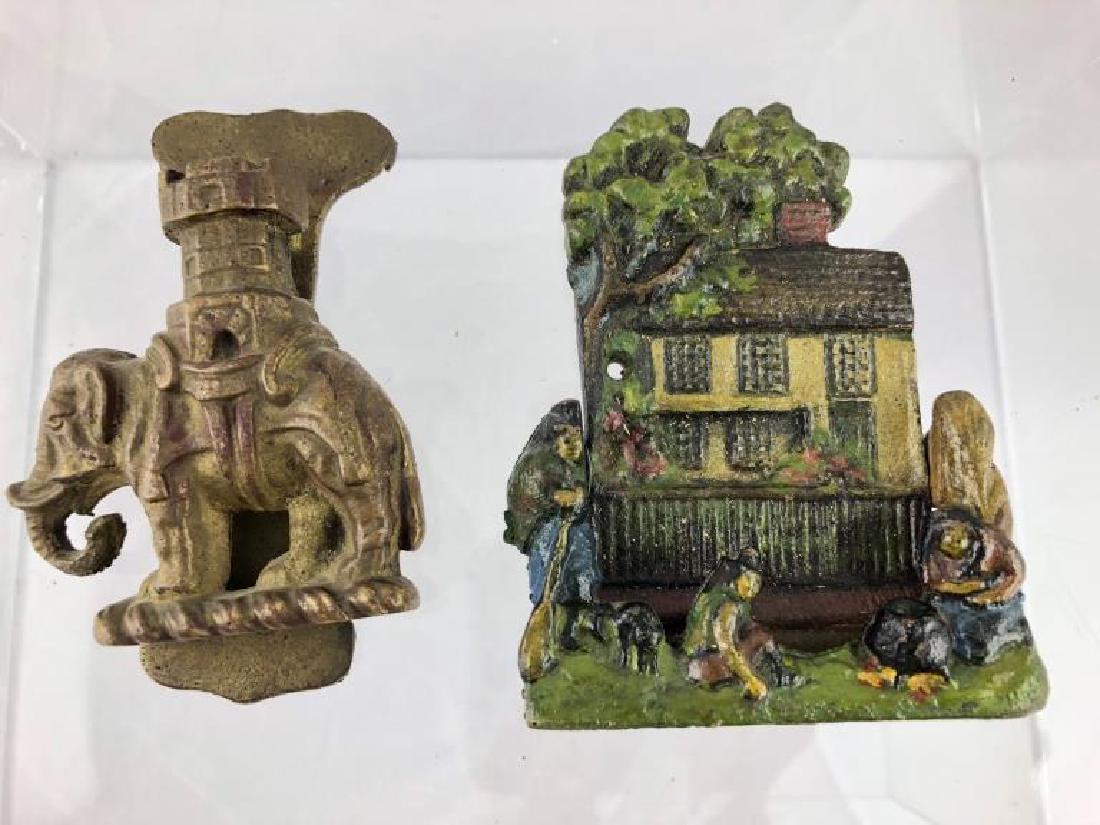 Lot of 2 Cast Iron Door Knockers (House &Elephant): First in this lot is a wonderful vintage cast iron house door knocker signed Sara Symonds. The second item in this lot is a Door Knocker w/ an Elephant Motif.