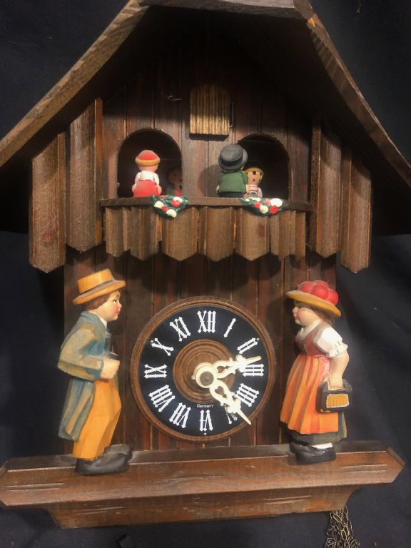 1950's German Musical Time & Strike Cuckoo Clock: 1950's Vintage German Musical Time & Strike 30 Hour Cuckoo Clock with Handcarving and handpainted girl and boy. Includes 3 weights and pendulum. Measures: H 9-3/4"x 12".