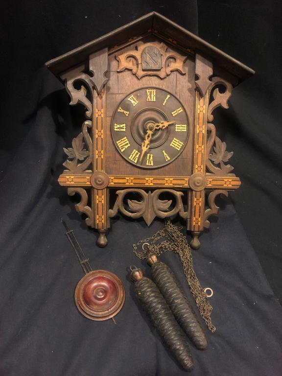 1890 Handcarved German Cuckoo Clock w/ Inlay Trim: Beautiful workmanship on this detailed inlayed and carved front late 1800-early 1900 German Antique Cuckoo Clock with real wooden handcarved cuckoo bird. Thick original plates, 2 weights and wooden pe