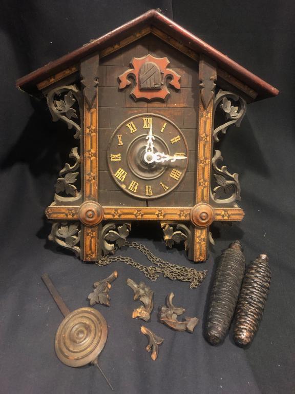 1900 Germam Handcarved Cuckoo Clock w/ Inlay Trim,: Beautiful workmanship on this detailed inlayed and carved front 1900 German Antique Cuckoo Clock with real wooden handcarved cuckoo bird. Thick original plates, 2 weights and wooden pendulum. Very nic