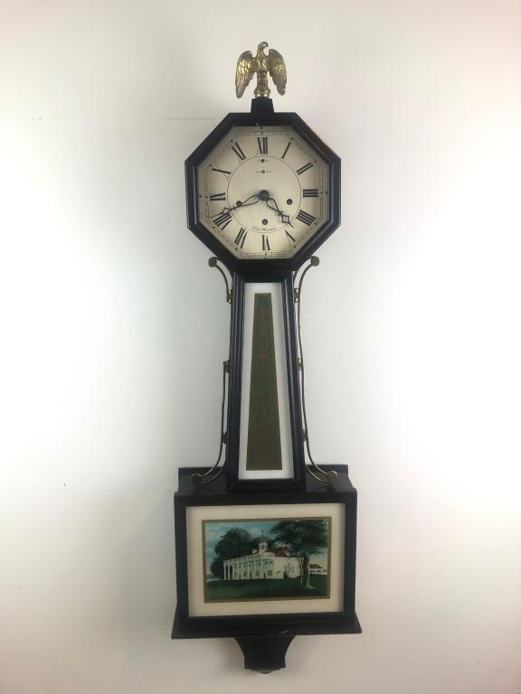 Exceptional New Haven 1880 Banjo Clock Tablet: 1880's New Haven Banjo Wall Clock w/ Solid Brass Eagle Finial and decorative brass side arms. 8 day, time, strike and chime. Chime silence lever. 2 Original Reverse Painted Panels in Pristine/Mint Con