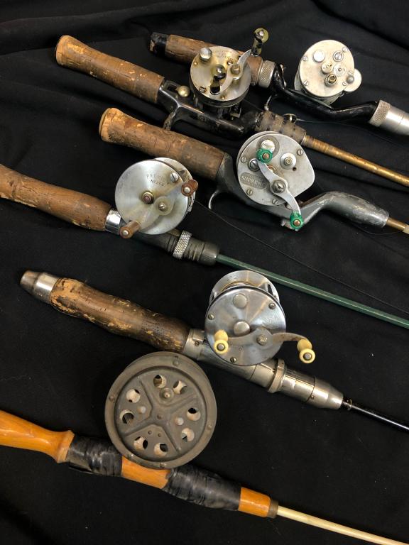 Lot of Vintage Fishing Rods & Reels: A Lot of 6 Vintage Collectible Fishing Rods & Reels. Collection includes a supreme vintage Pflueger No. 1963, in good condition, a Shakespeare Criterium -1960, Premium No. 250. A vintage American rod.